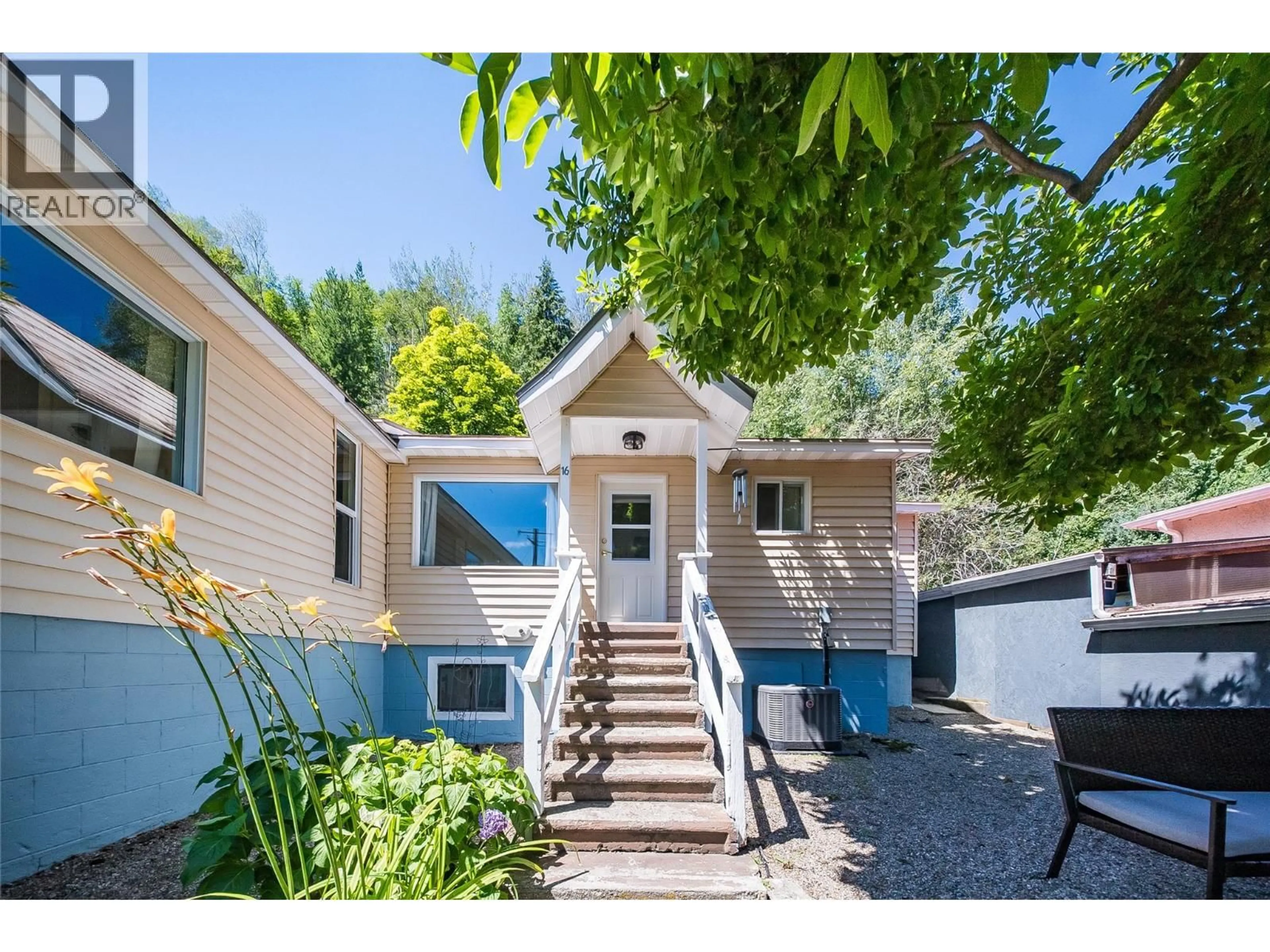 Home with vinyl exterior material, street for 16 HANNA DRIVE, Trail British Columbia V1R4V6