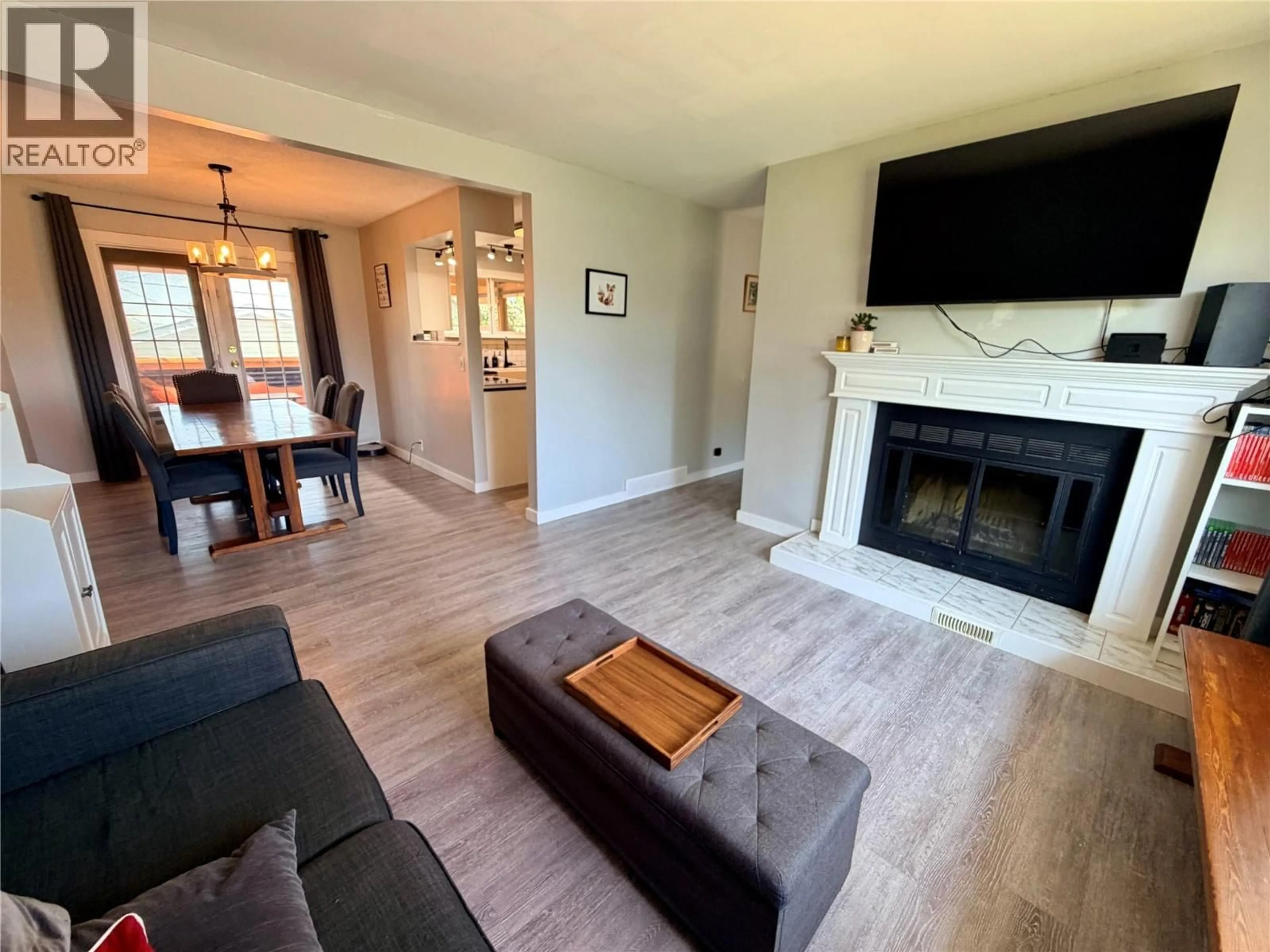 Living room with furniture, wood/laminate floor for 9401 7 STREET, Dawson Creek British Columbia V1G3M7