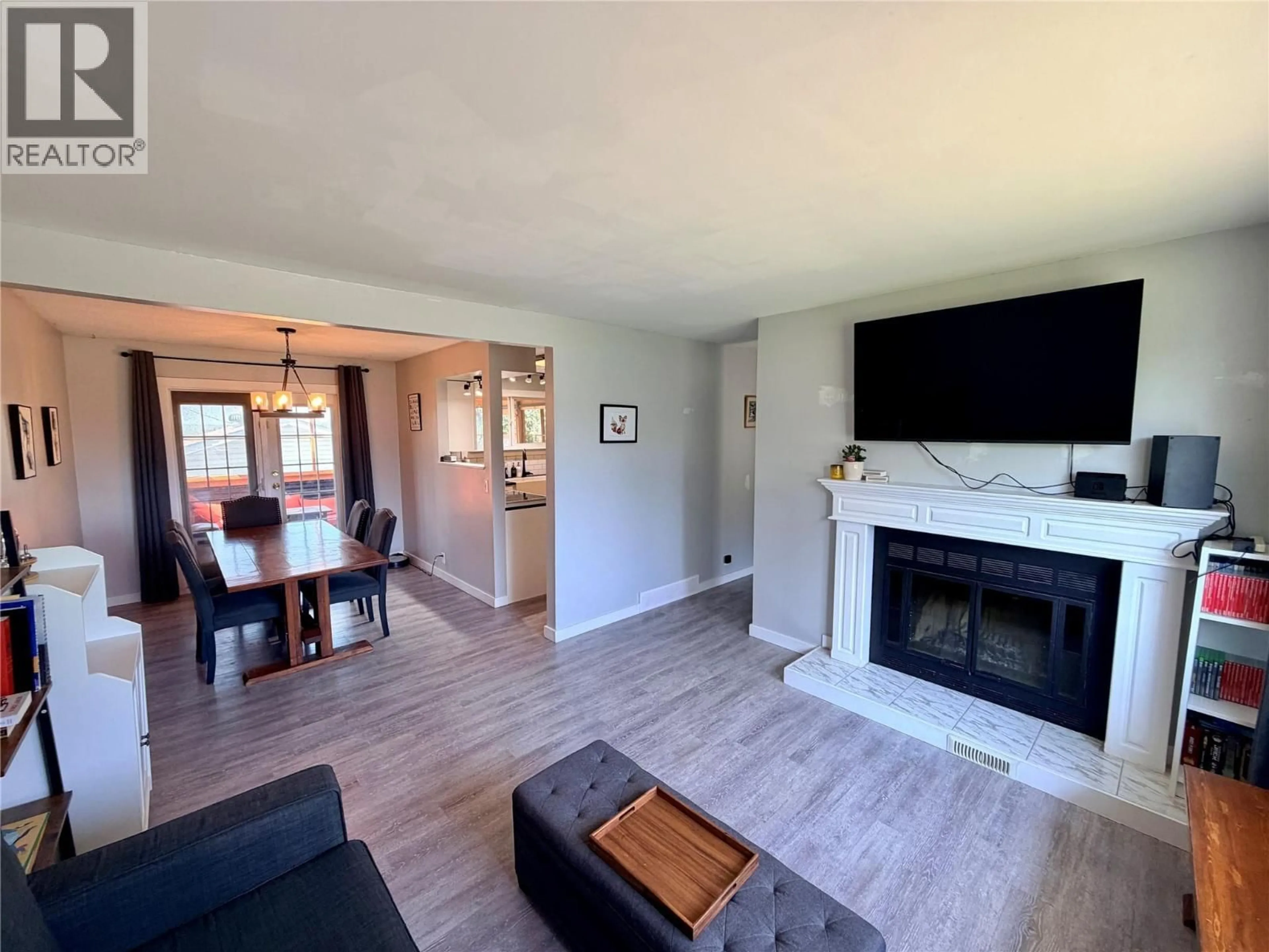 Living room with furniture, wood/laminate floor for 9401 7 STREET, Dawson Creek British Columbia V1G3M7