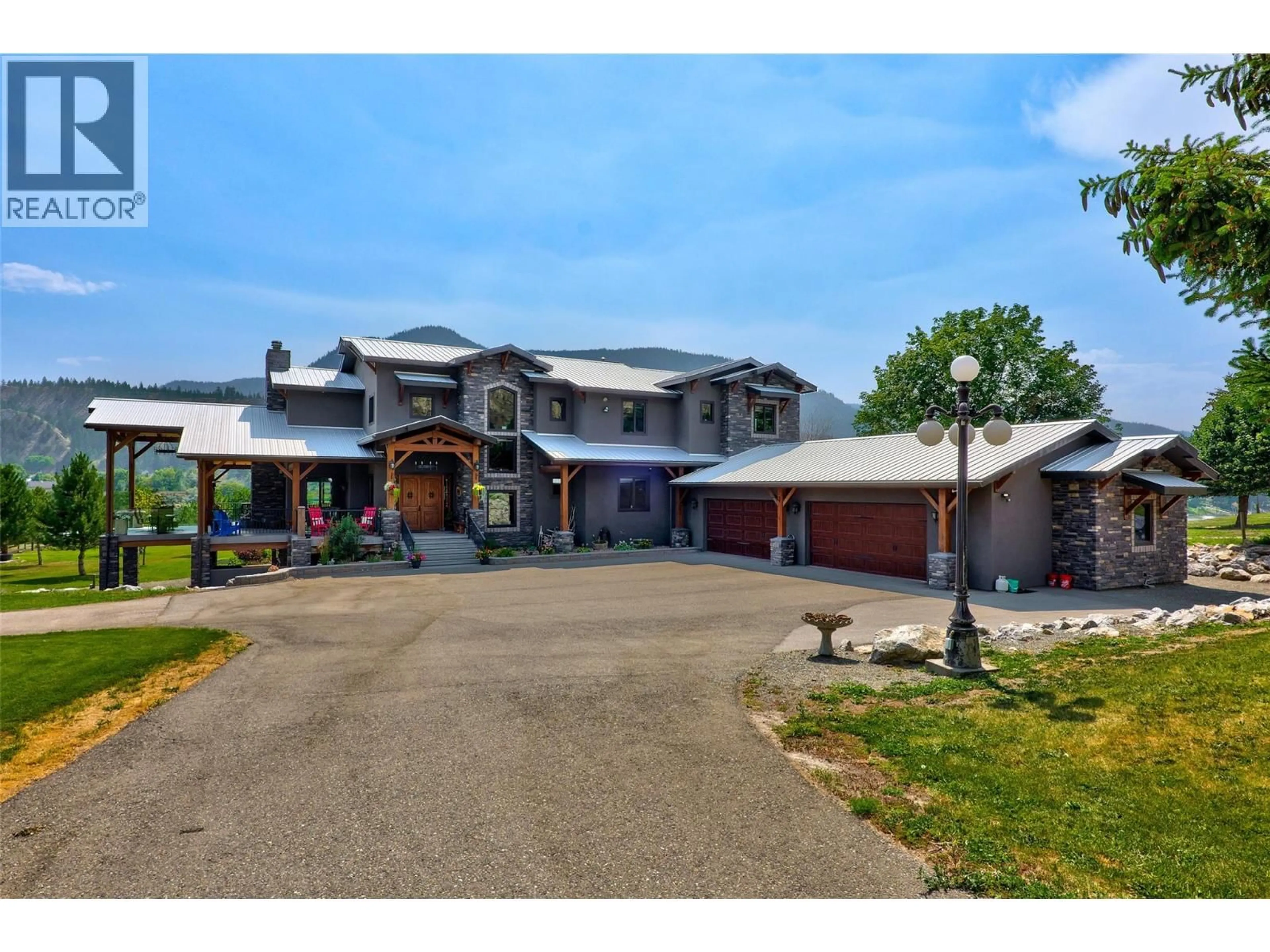 A pic from outside/outdoor area/front of a property/back of a property/a pic from drone, building for 1918 SHUSWAP ROAD EAST, Kamloops British Columbia V2H1S9