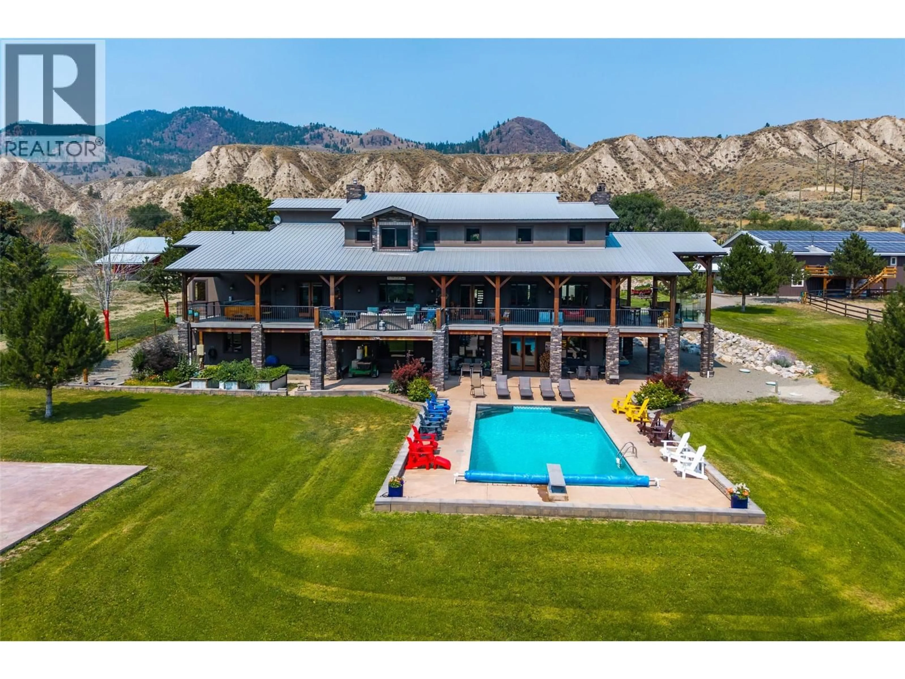 A pic from outside/outdoor area/front of a property/back of a property/a pic from drone, mountain view for 1918 SHUSWAP ROAD EAST, Kamloops British Columbia V2H1S9