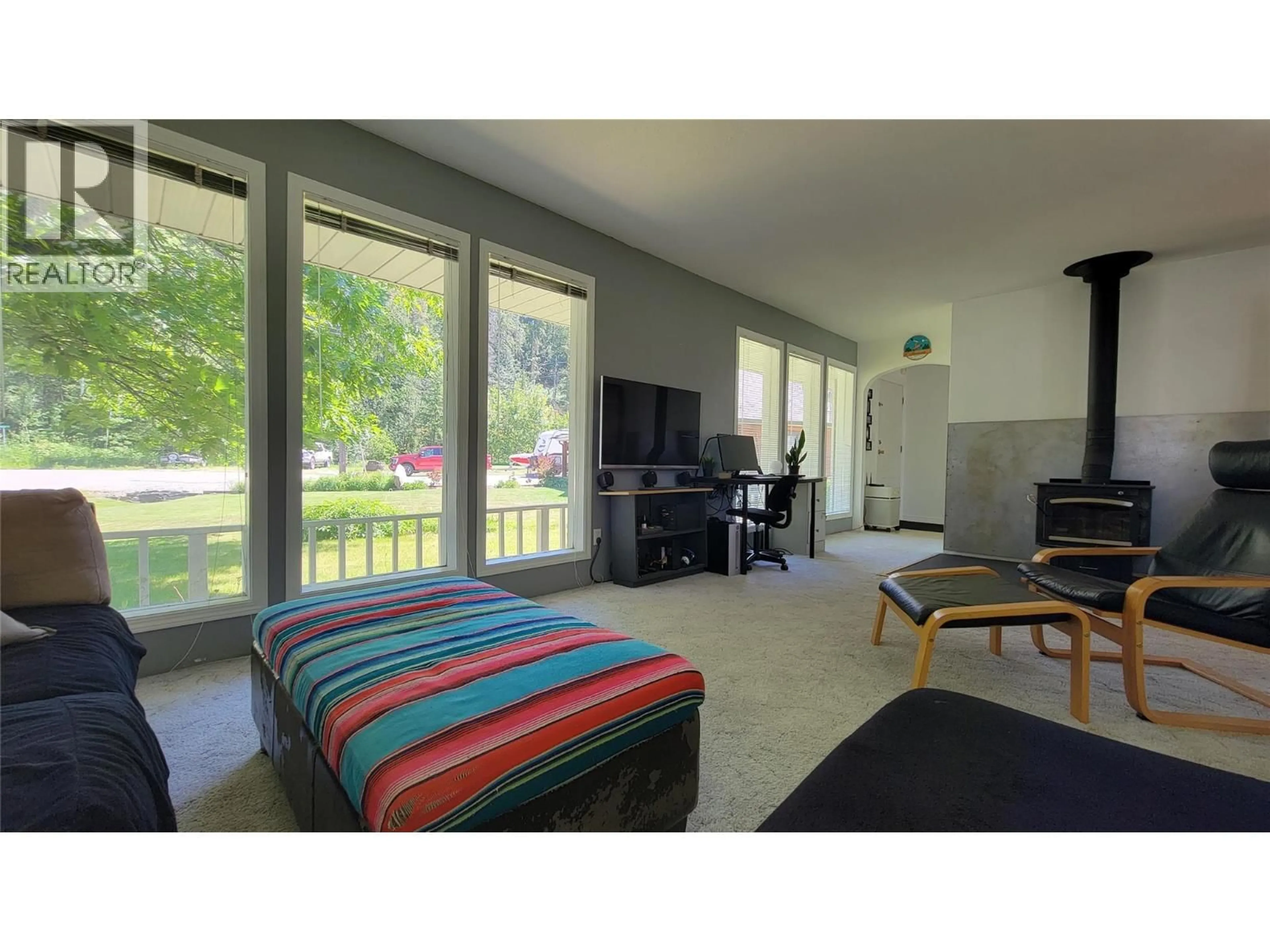 Living room with furniture, wood/laminate floor for 422 DOGWOOD AVENUE, Sicamous British Columbia V0E2V1