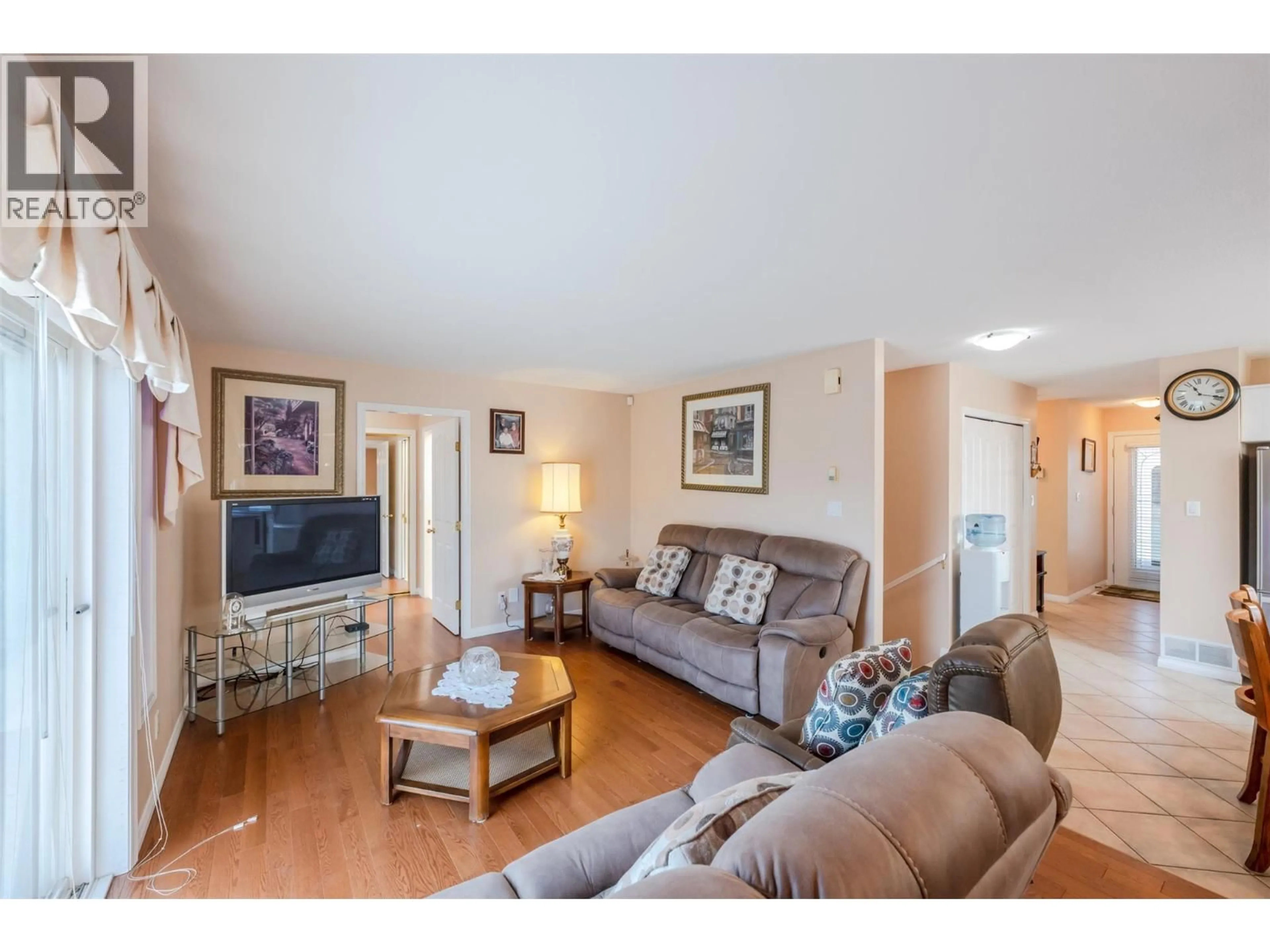 Living room with furniture, wood/laminate floor for 1 - 6163 SAINT MARTIN PLACE, Oliver British Columbia V0H1T0