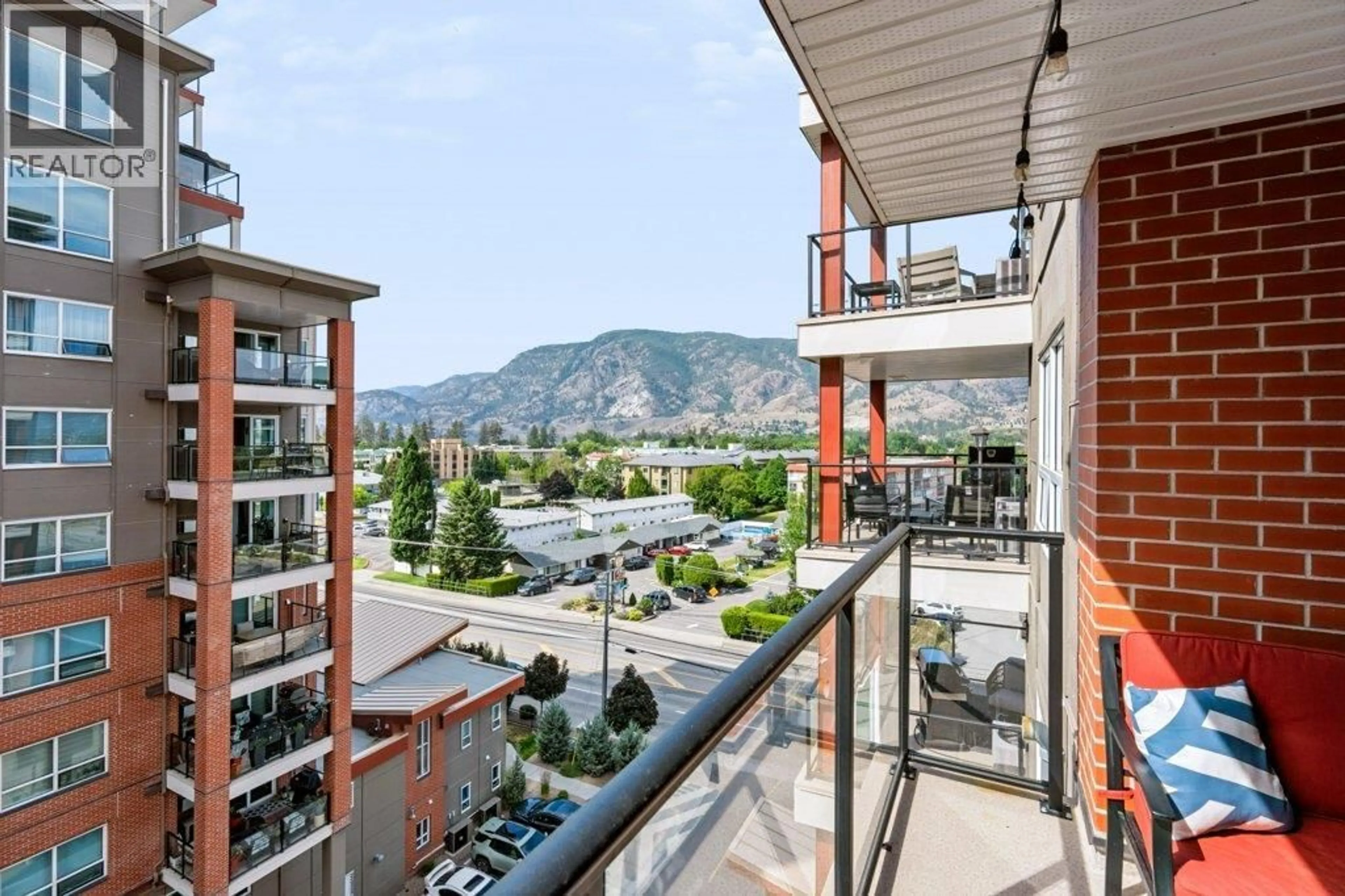 Balcony in the apartment, city buildings view from balcony for 706 - 3346 SKAHA LAKE ROAD, Penticton British Columbia V2A0H6