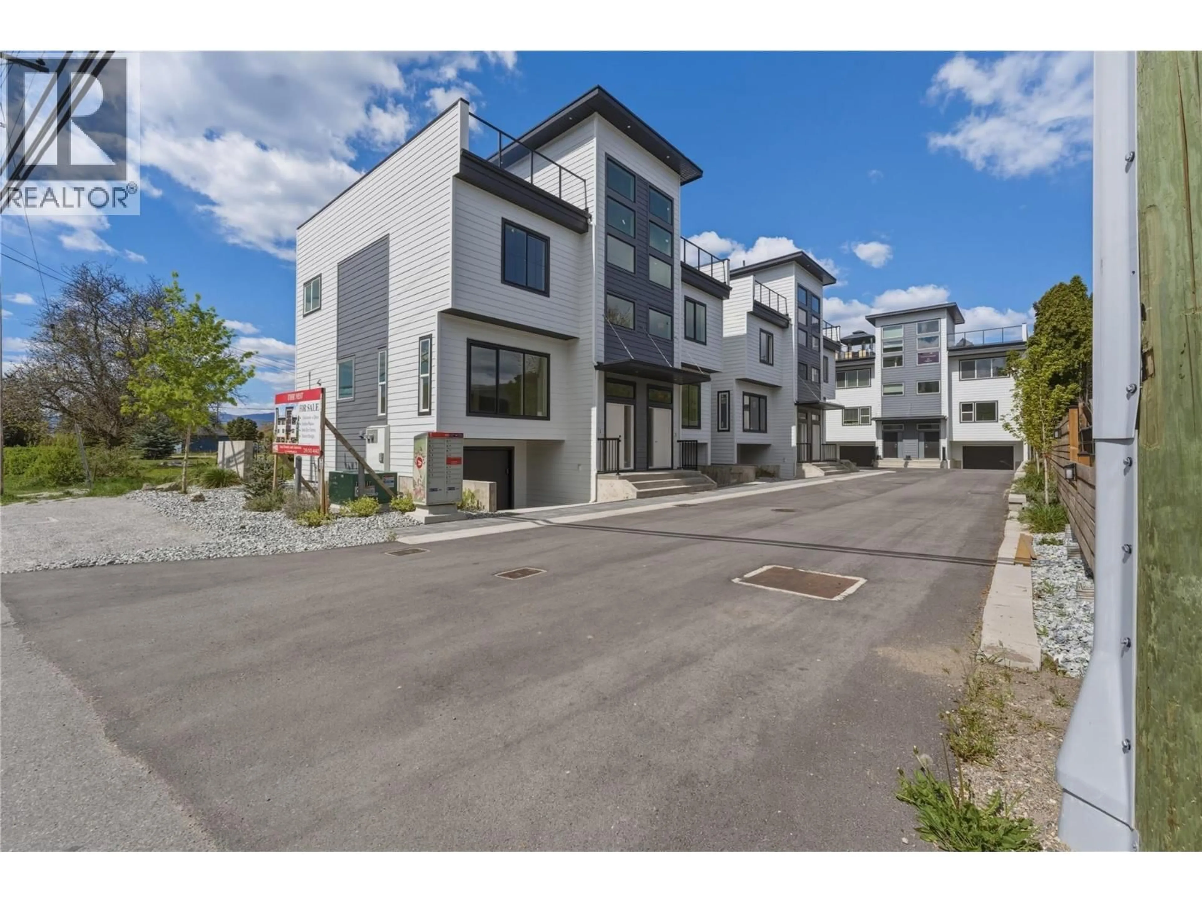 A pic from outside/outdoor area/front of a property/back of a property/a pic from drone, street for 3 - 5661 OKANAGAN LANDING ROAD, Vernon British Columbia V1T7A6