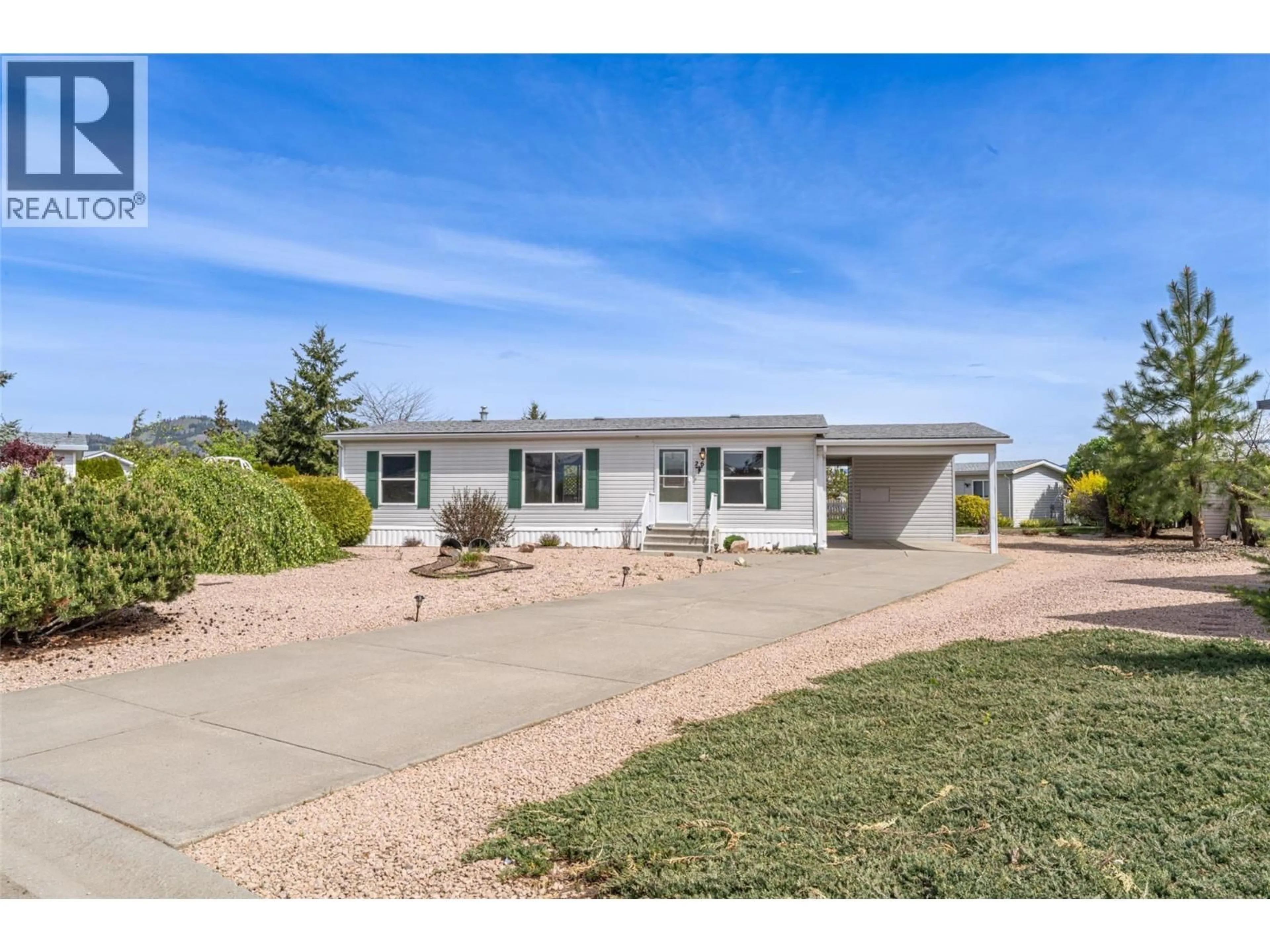 Home with vinyl exterior material, street for 26 - 9510 HIGHWAY 97 OTHER NORTH, Vernon British Columbia V1H1R8