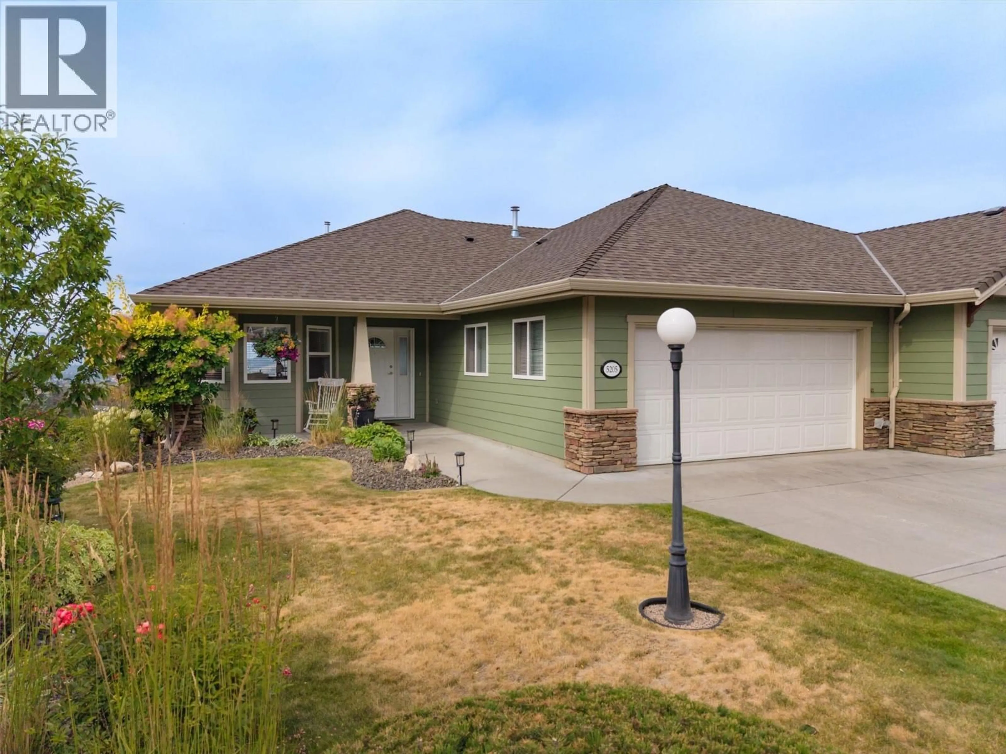 Home with vinyl exterior material, street for 5205 SANDHILLS DRIVE, Kelowna British Columbia V1X7Y7