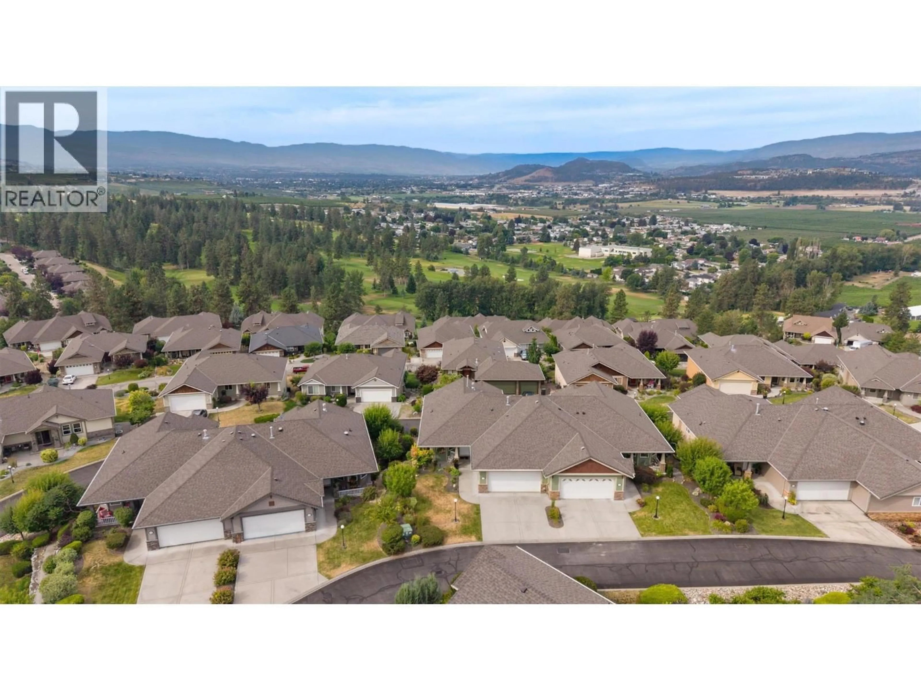A pic from outside/outdoor area/front of a property/back of a property/a pic from drone, mountain view for 5205 SANDHILLS DRIVE, Kelowna British Columbia V1X7Y7