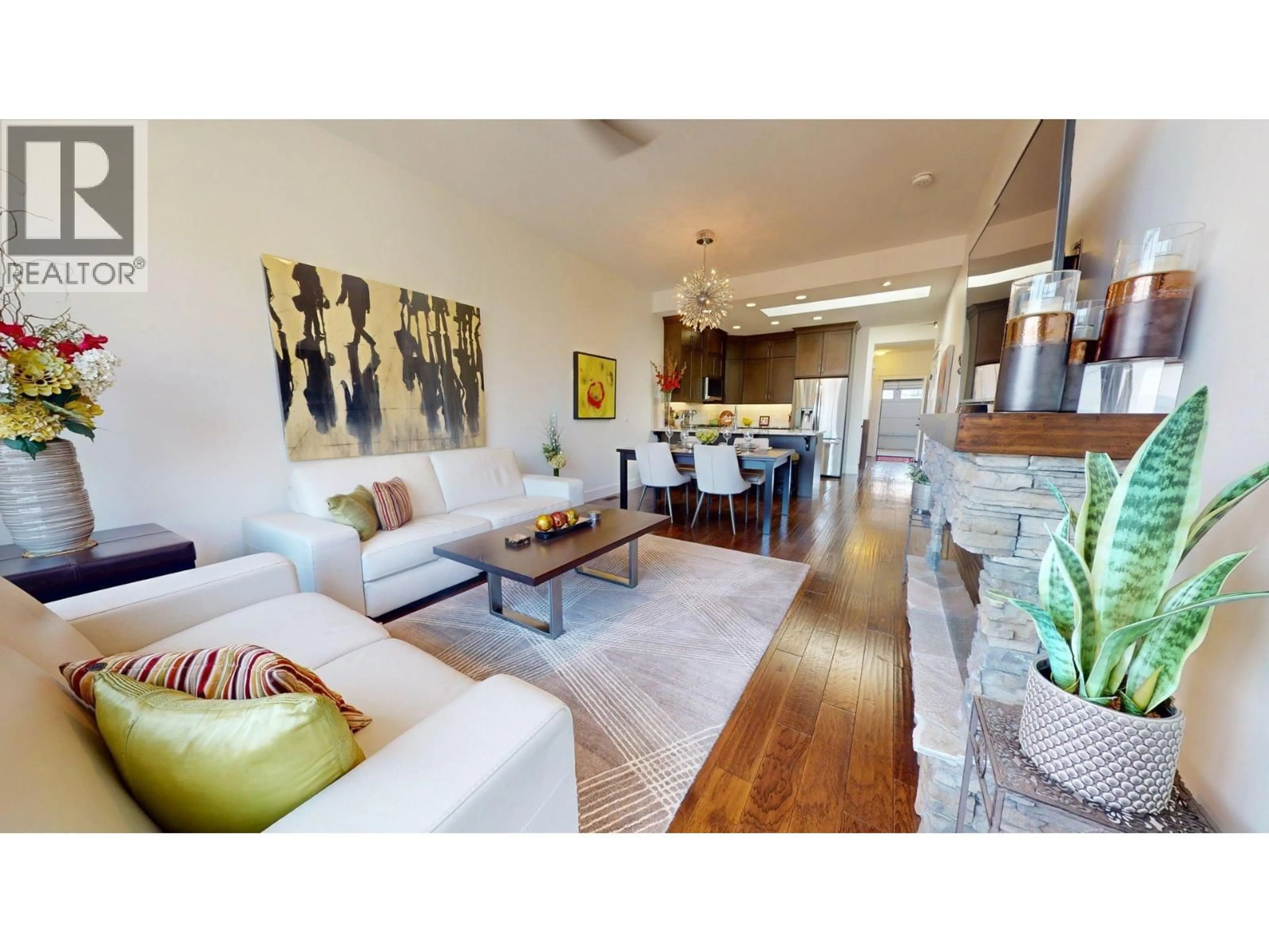 Living room with furniture, wood/laminate floor for 1696 LAKE VISTA ROAD, Kelowna British Columbia V1Z4E1