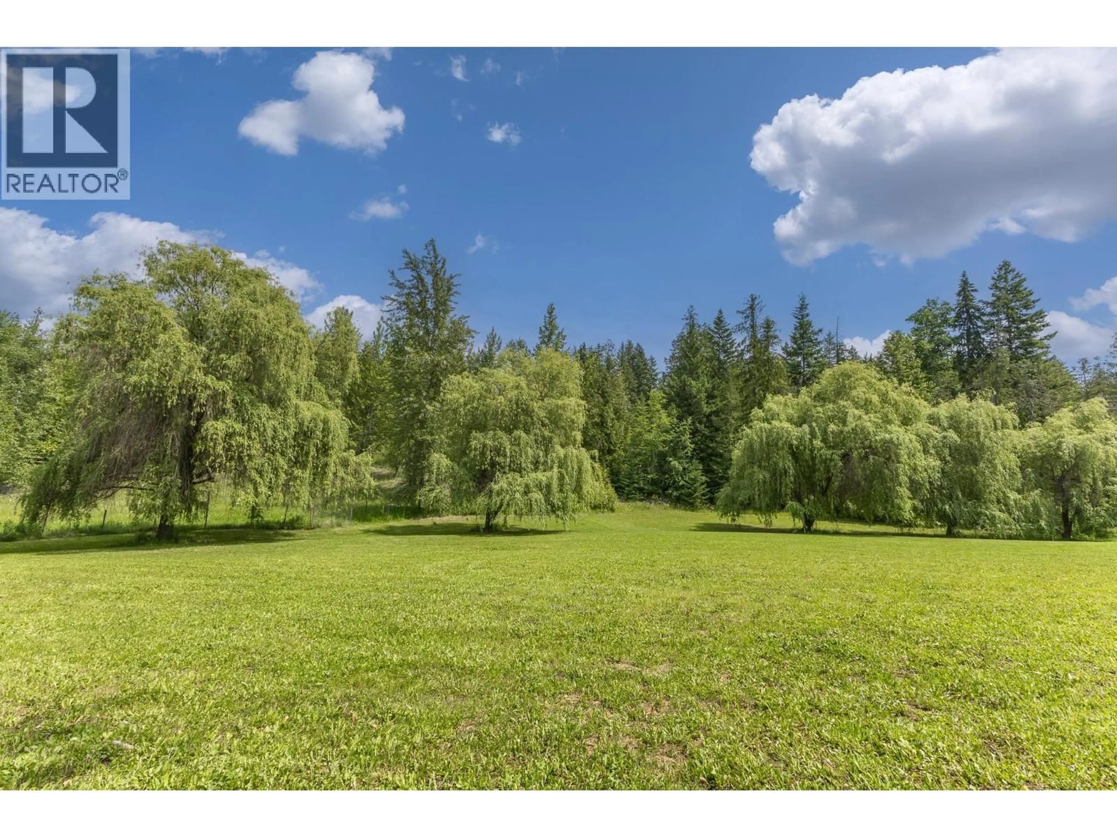 A pic from outside/outdoor area/front of a property/back of a property/a pic from drone, forest/trees view for 5060 TATLOW ROAD, Salmon Arm British Columbia V1E2P8