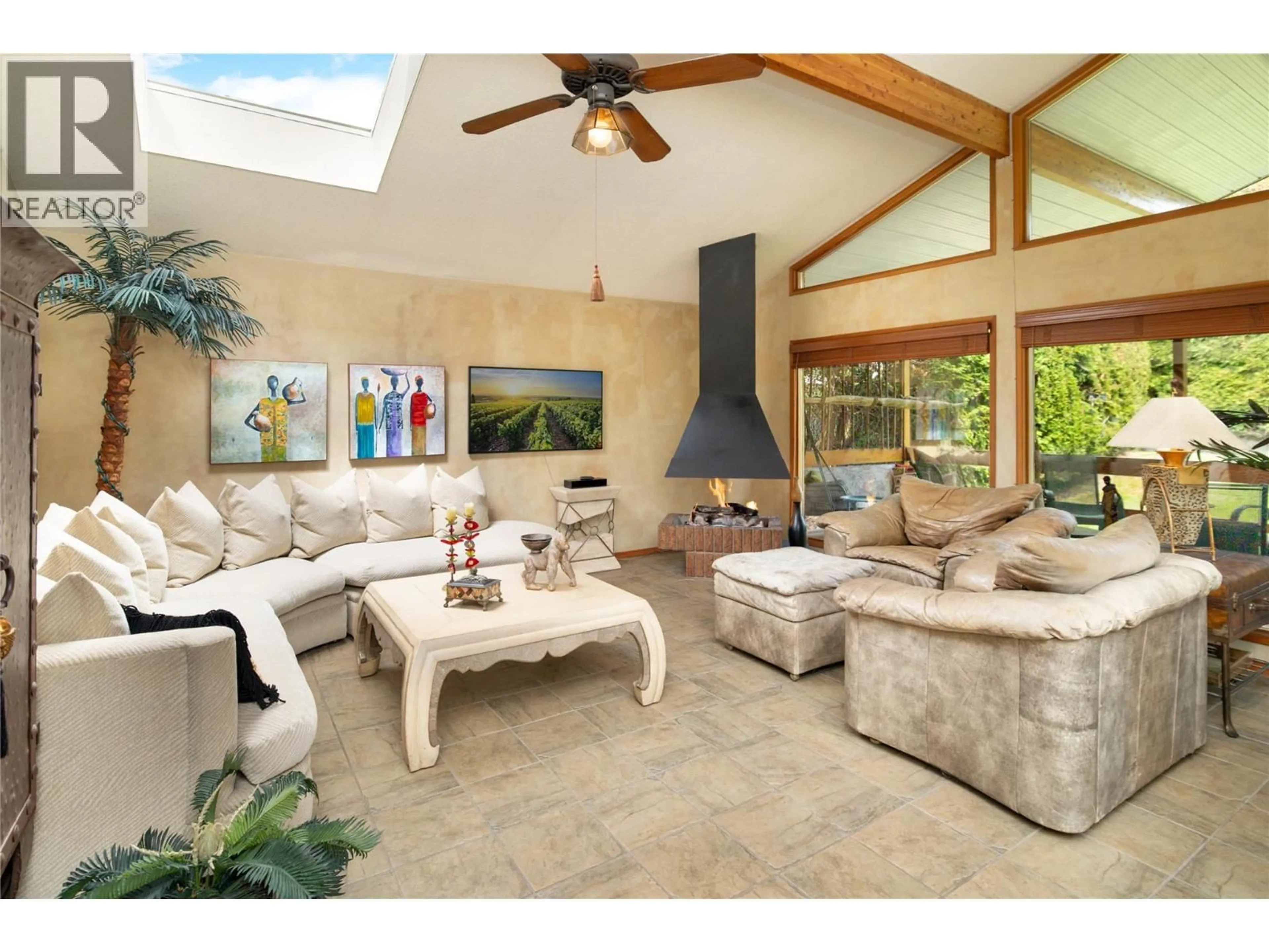 Living room with furniture, ceramic/tile floor for 1109 PINECREST LANE, Kelowna British Columbia V1Y4L4