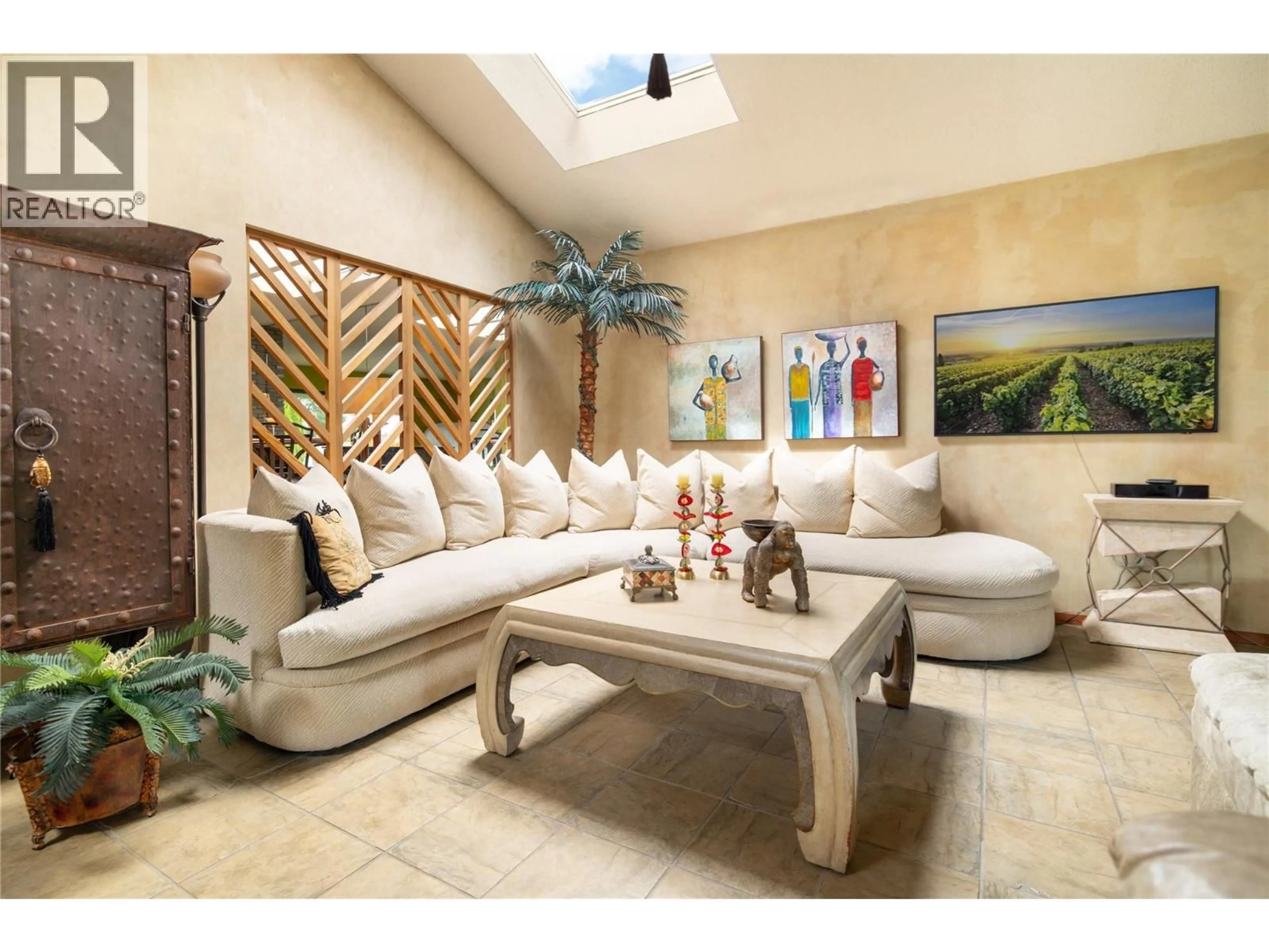 Living room with furniture, ceramic/tile floor for 1109 PINECREST LANE, Kelowna British Columbia V1Y4L4