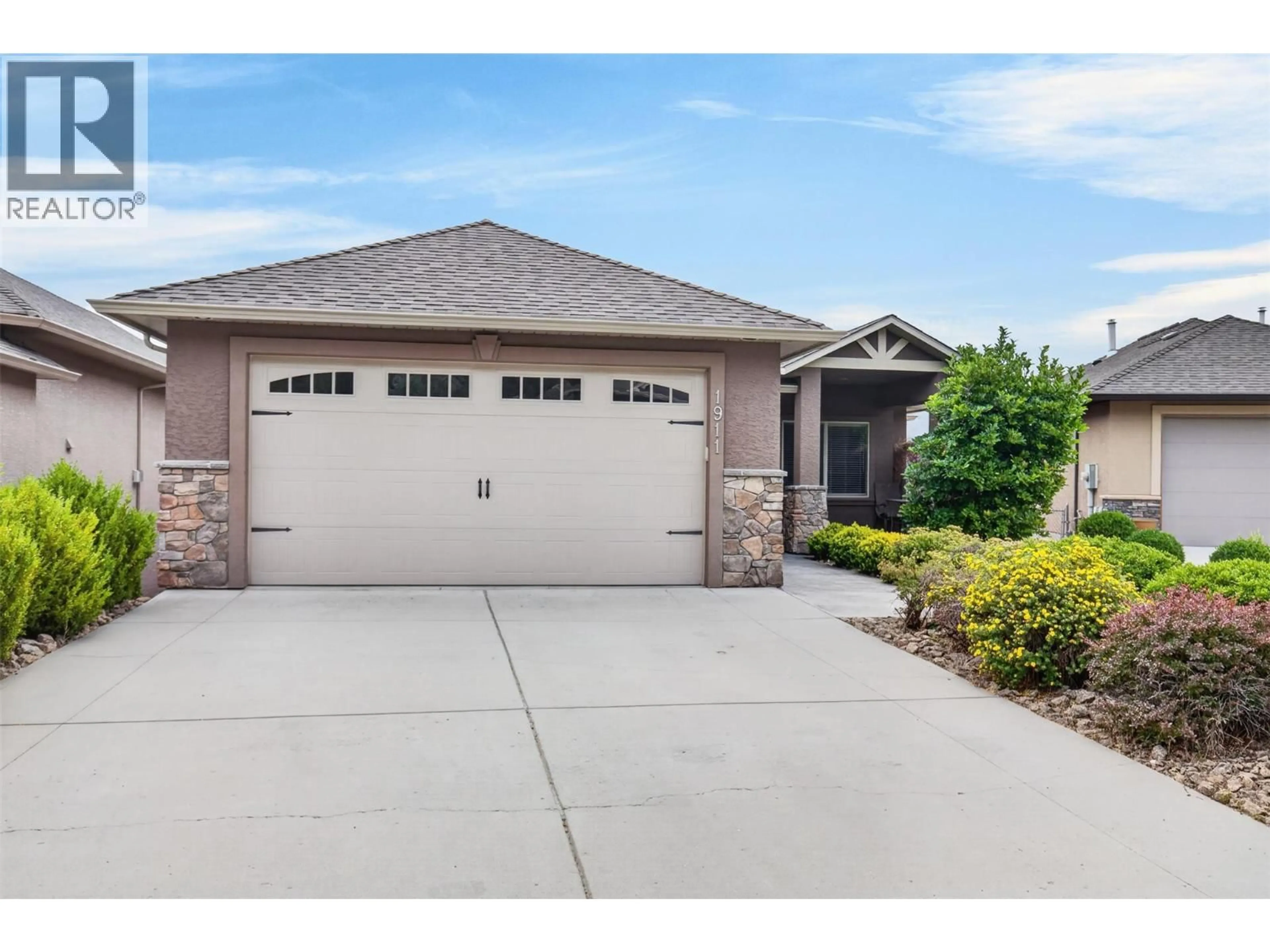 Home with vinyl exterior material, street for 1911 CORNERSTONE DRIVE, West Kelowna British Columbia V4T2Y3