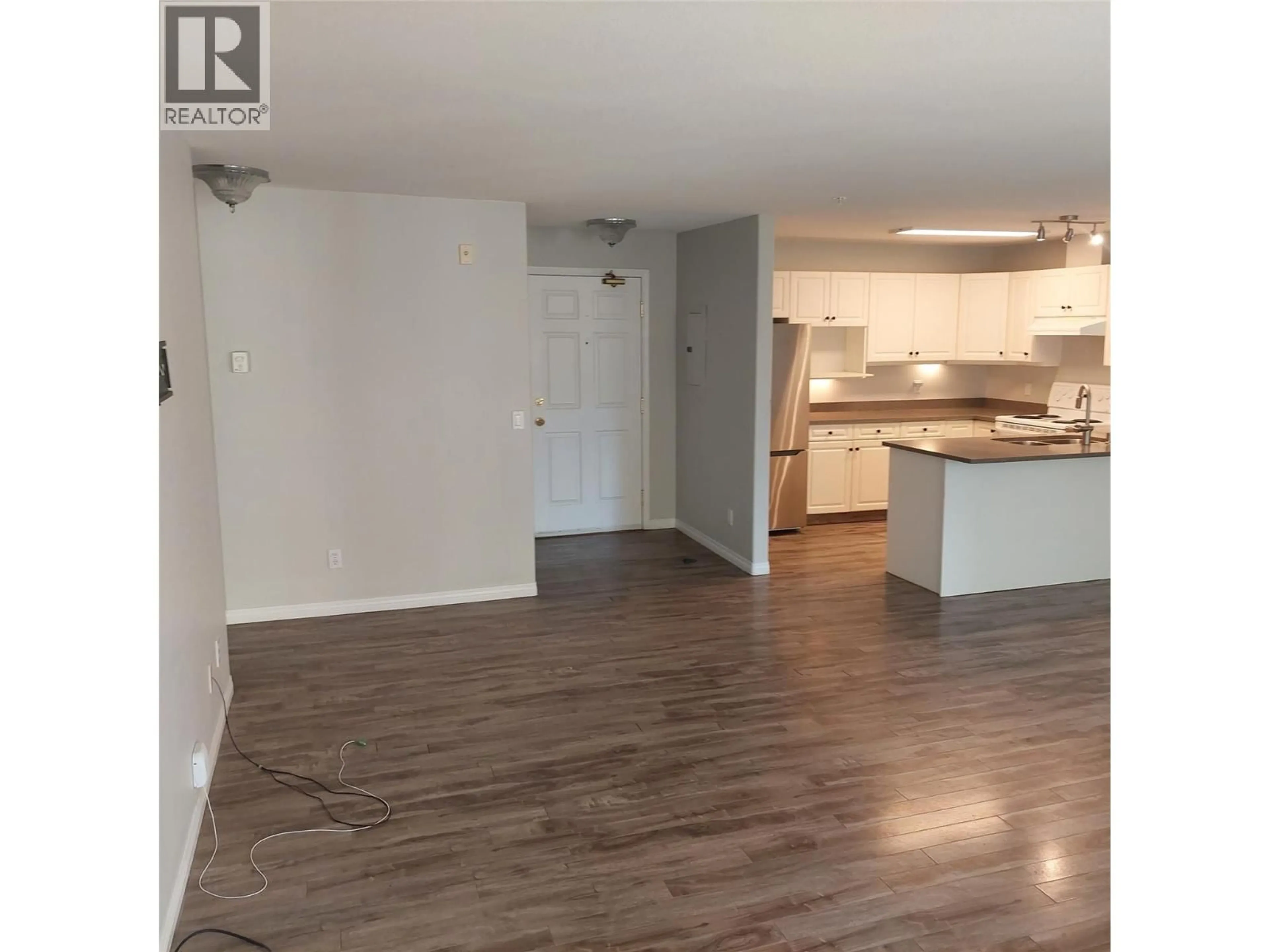 Open concept kitchen, wood/laminate floor for #206 - 1950 DURNIN ROAD, Kelowna British Columbia V1Y8K5