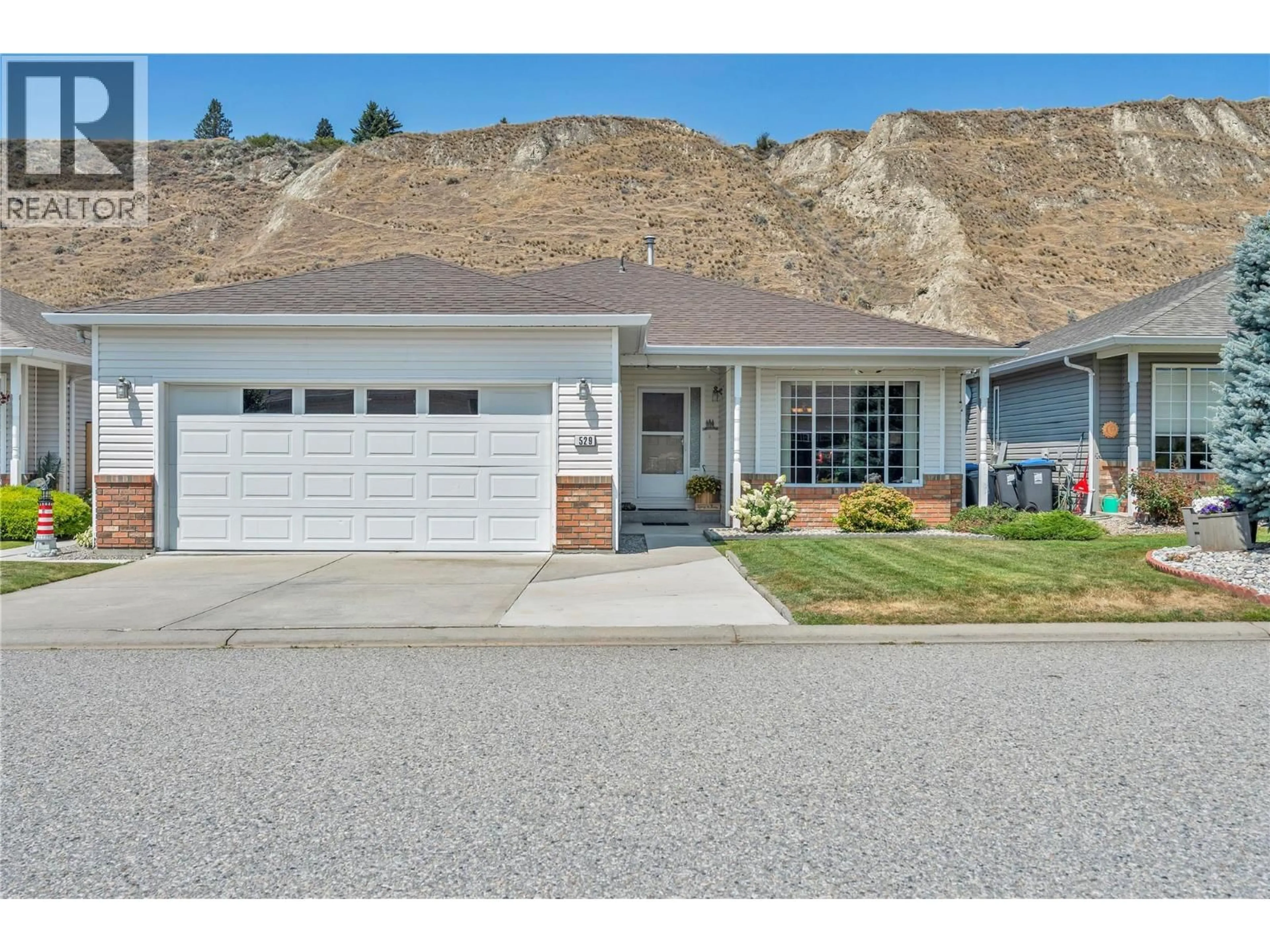 Home with vinyl exterior material, mountain view for 529 RED WING DRIVE, Penticton British Columbia V2A8N7
