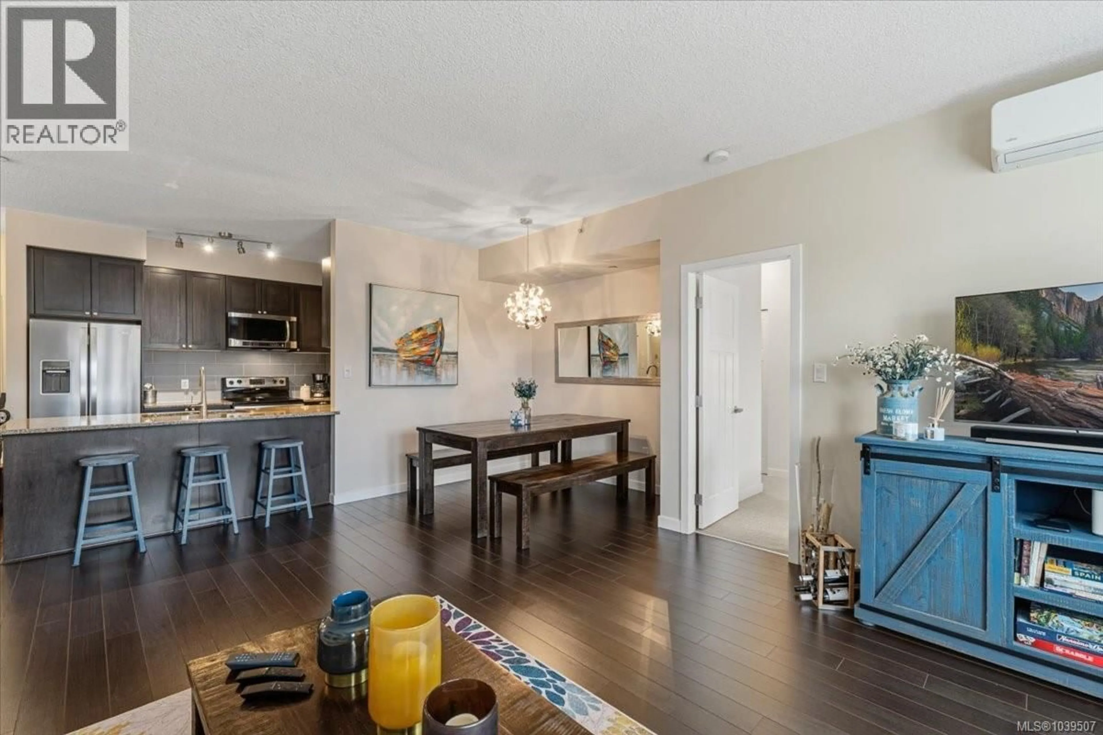 Open concept kitchen, wood/laminate floor for 411 - 99 CHAPEL STREET, Nanaimo British Columbia V9R5H3