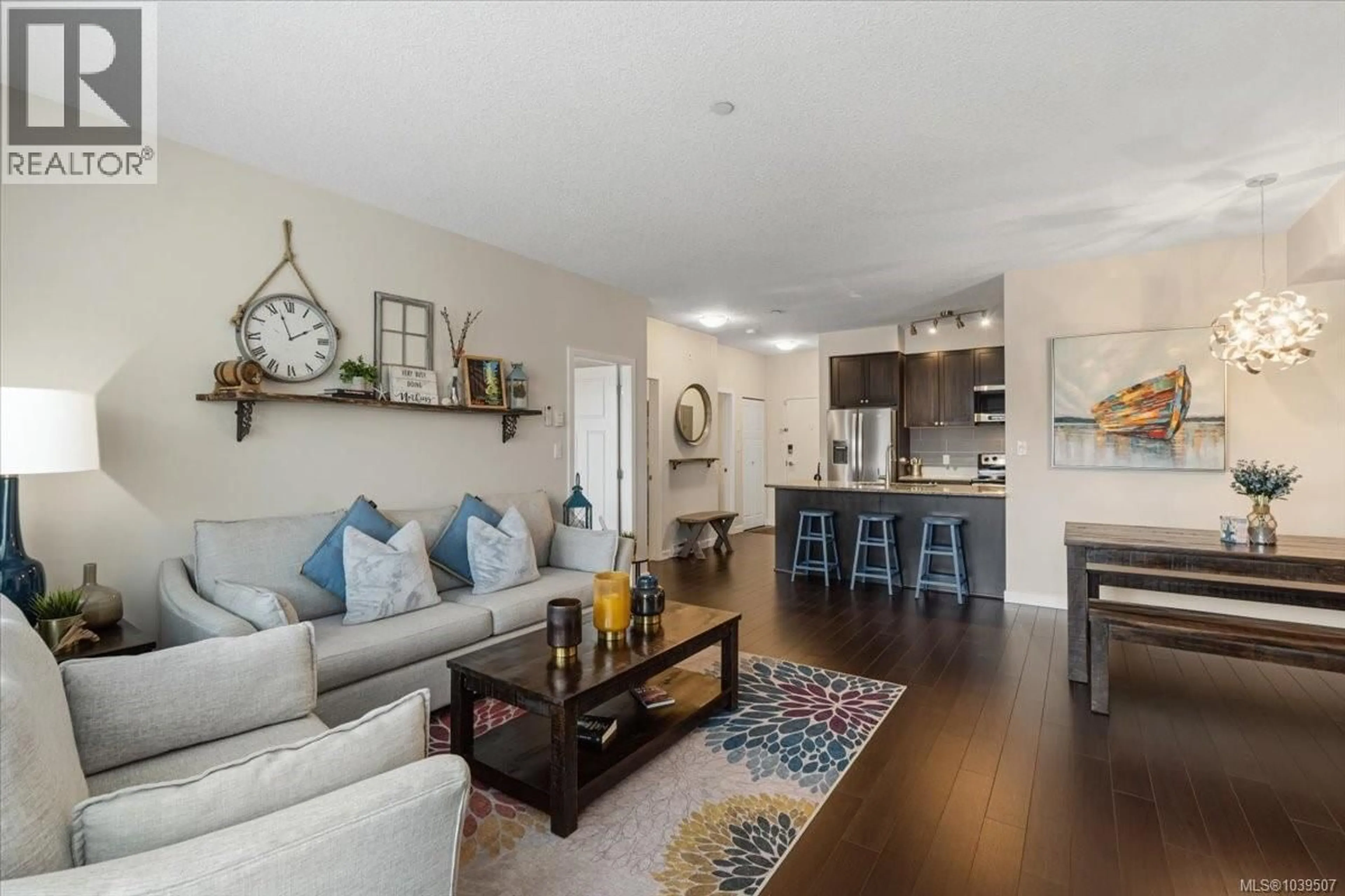 Living room with furniture, wood/laminate floor for 411 - 99 CHAPEL STREET, Nanaimo British Columbia V9R5H3