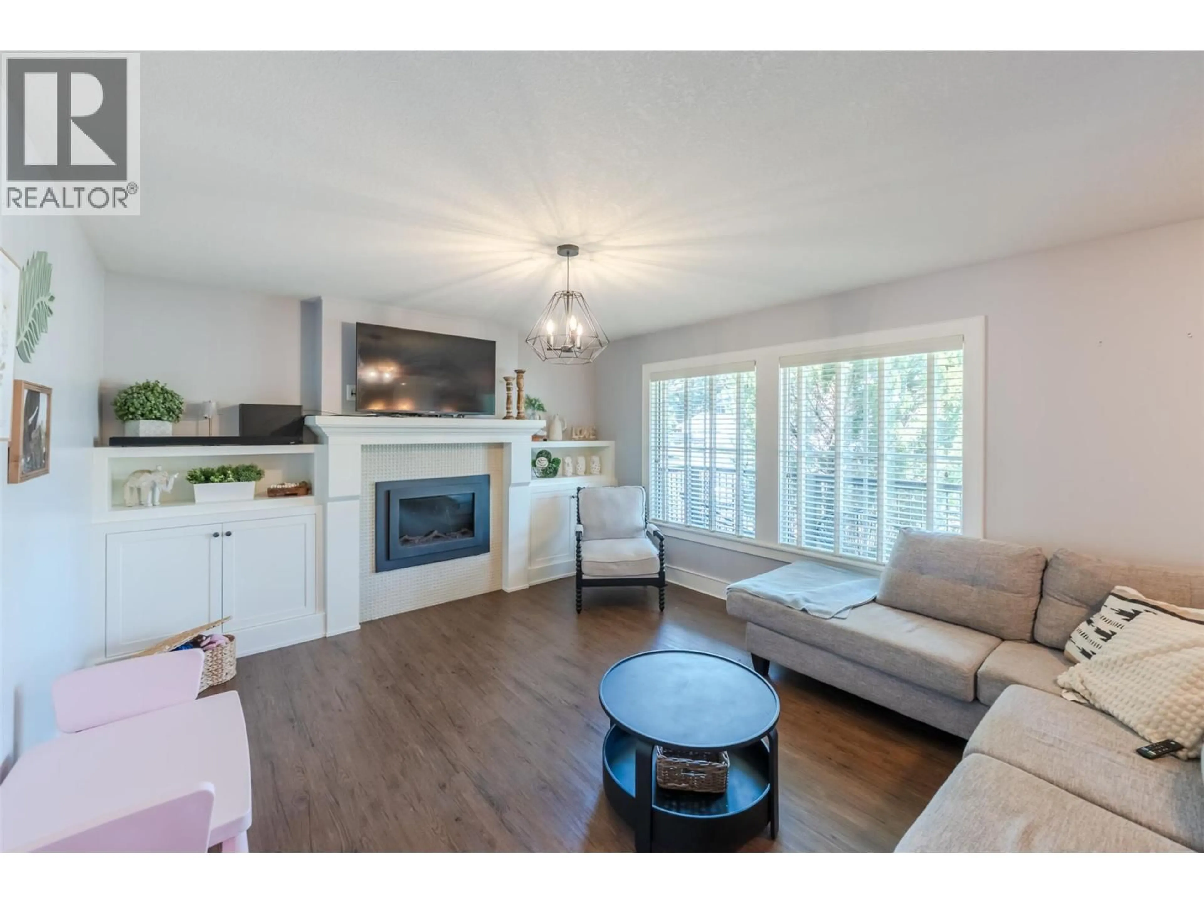 Living room with furniture, wood/laminate floor for 1507 WHARF STREET, Summerland British Columbia V0H1Z9