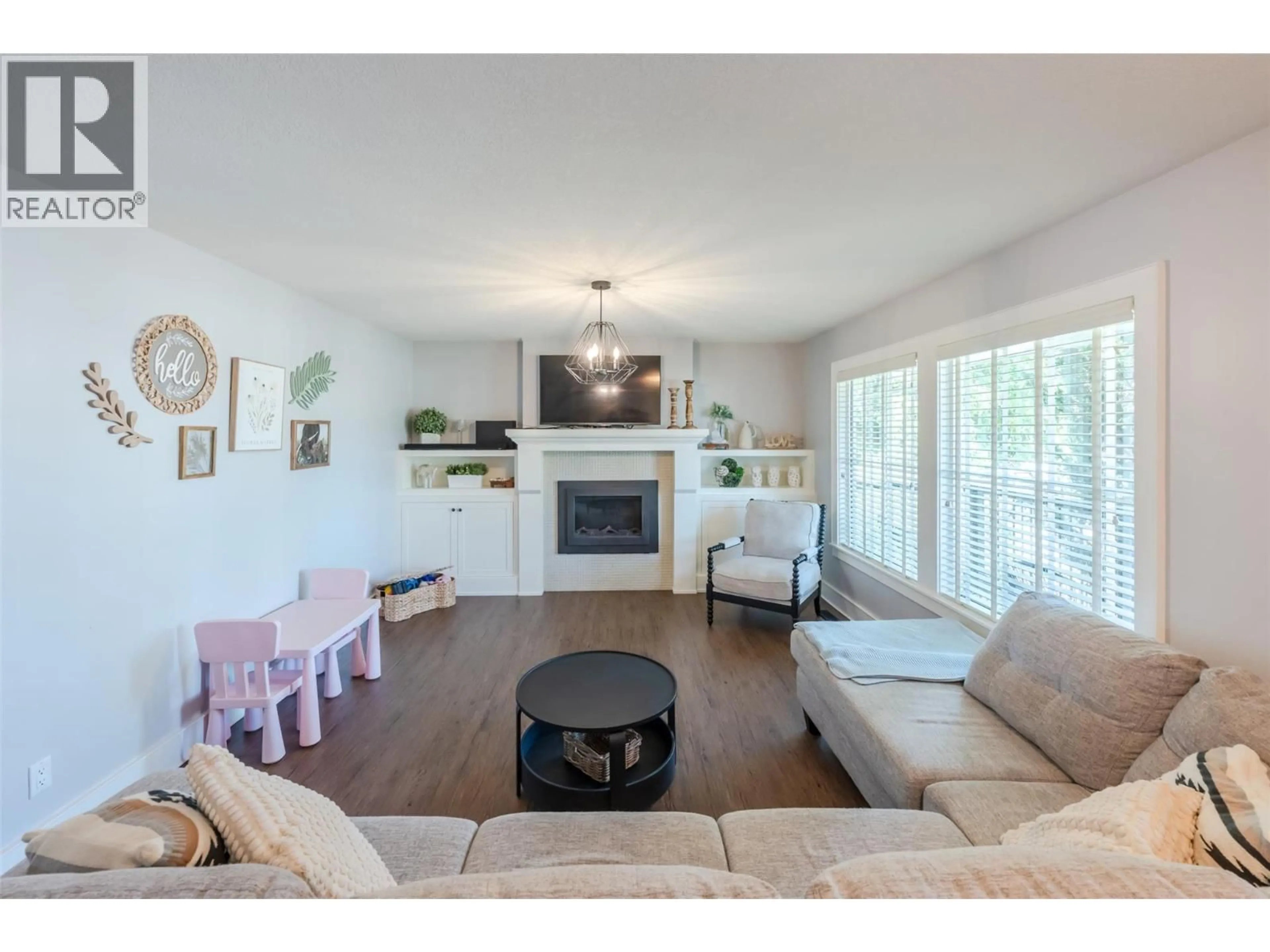 Living room with furniture, wood/laminate floor for 1507 WHARF STREET, Summerland British Columbia V0H1Z9