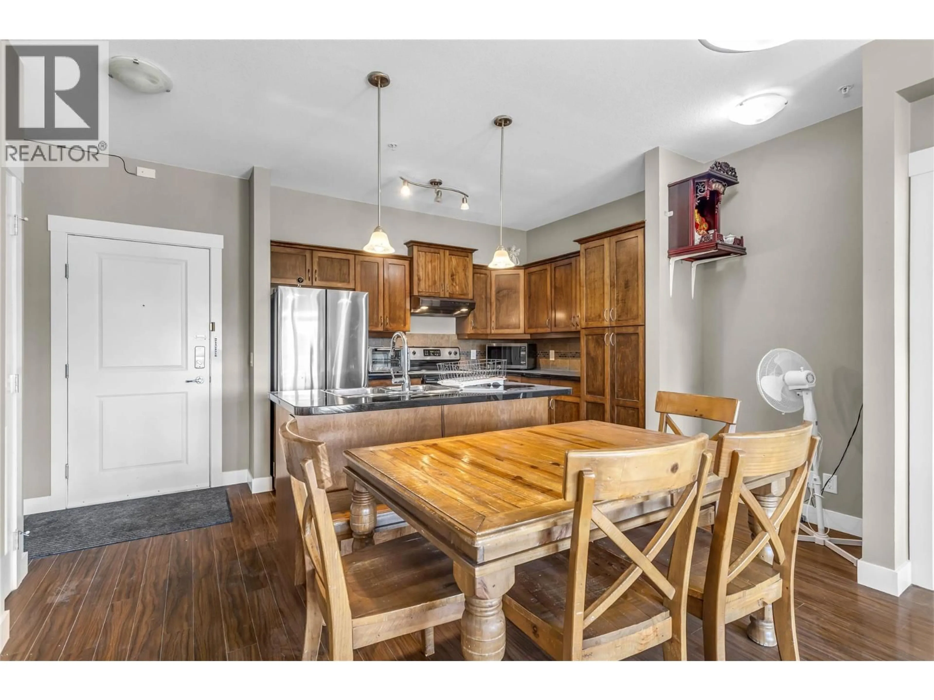 Open concept kitchen, wood/laminate floor for 306 - 3545 CARRINGTON ROAD, West Kelowna British Columbia V4T3A1