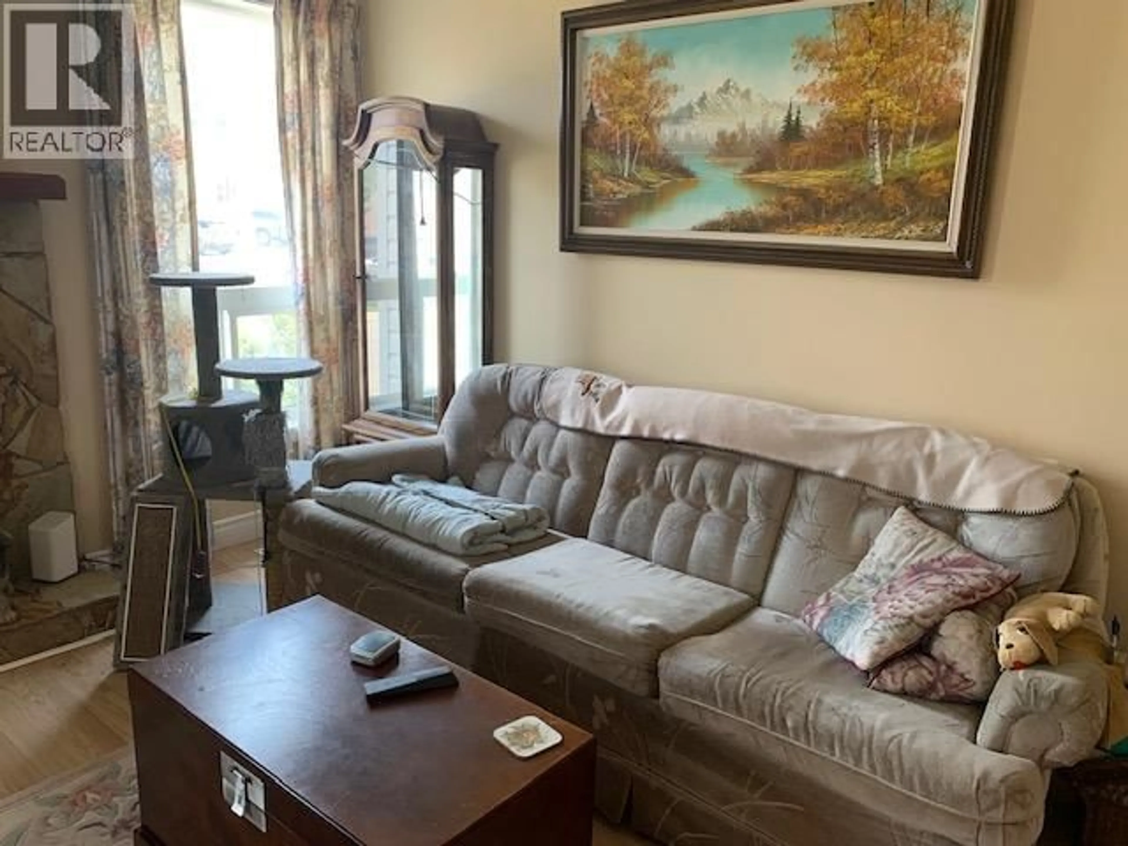 Living room with furniture, wood/laminate floor for 1243 PINYON ROAD, Sparwood British Columbia V0B2G2