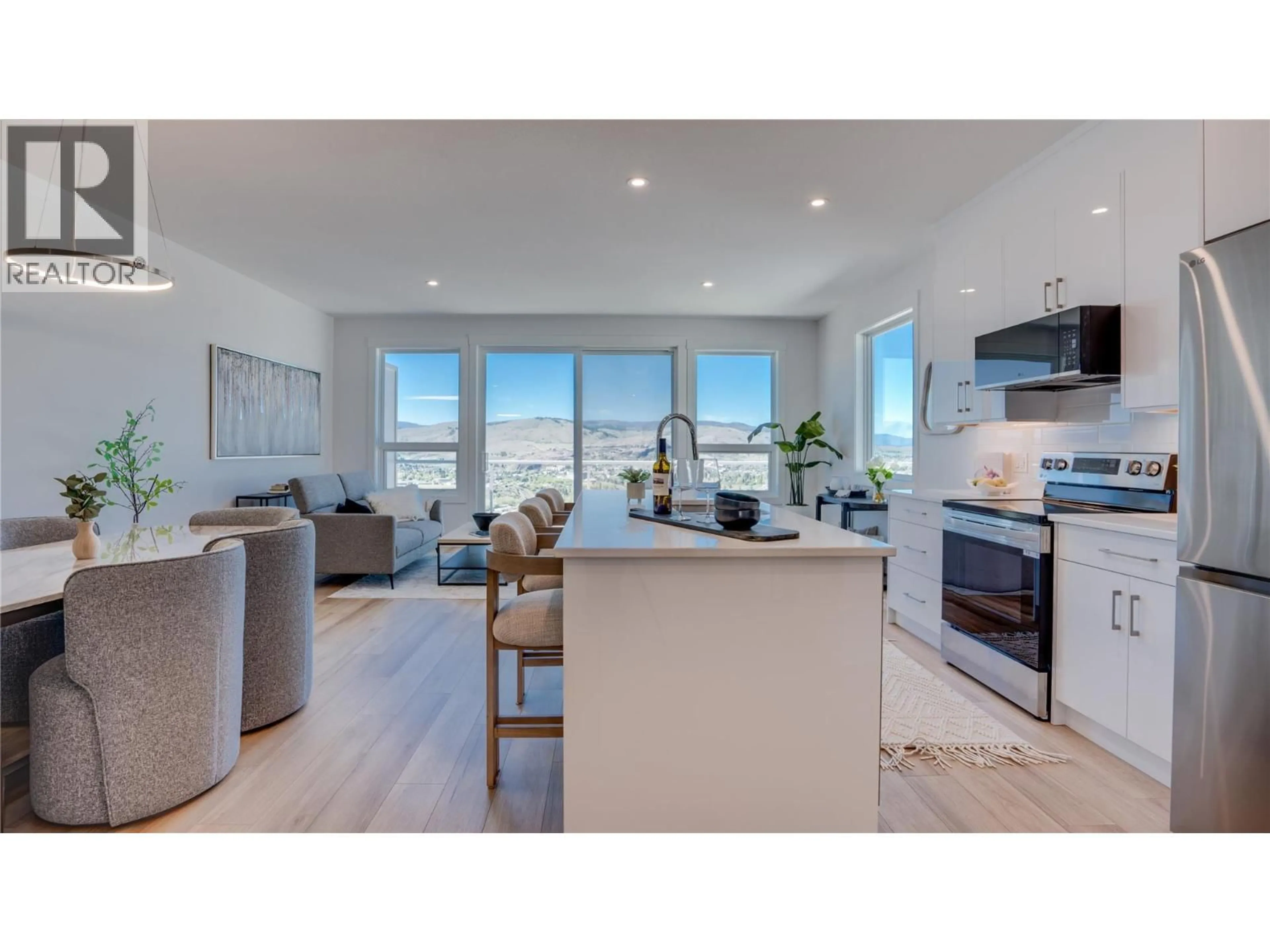 Open concept kitchen, wood/laminate floor for 2 - 1050 MT REVELSTOKE PLACE, Vernon British Columbia V1B3Z9