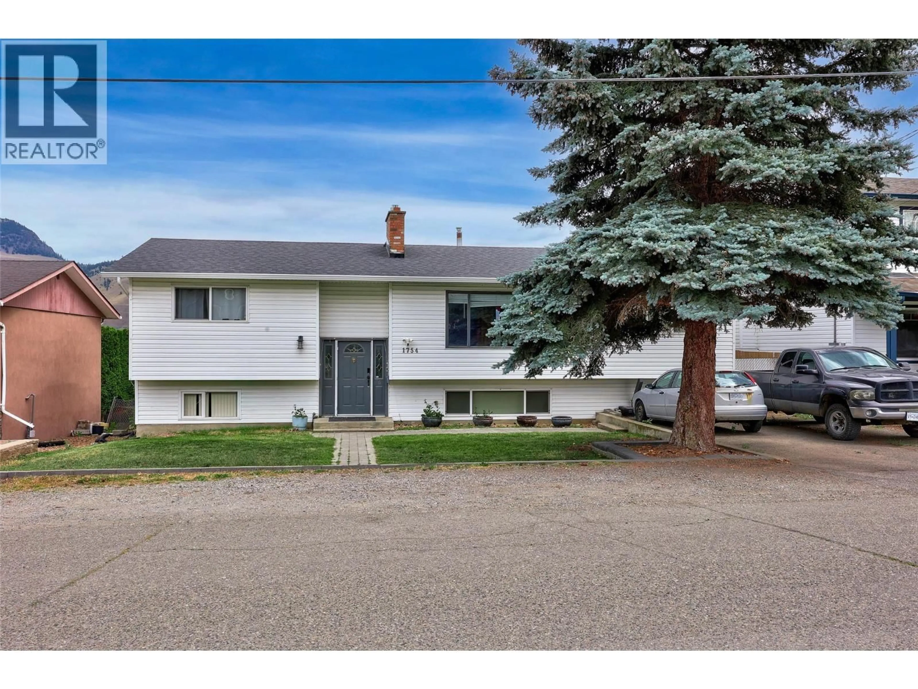 Home with vinyl exterior material, street for 1754 SHERIDAN DRIVE, Kamloops British Columbia V2B6A9