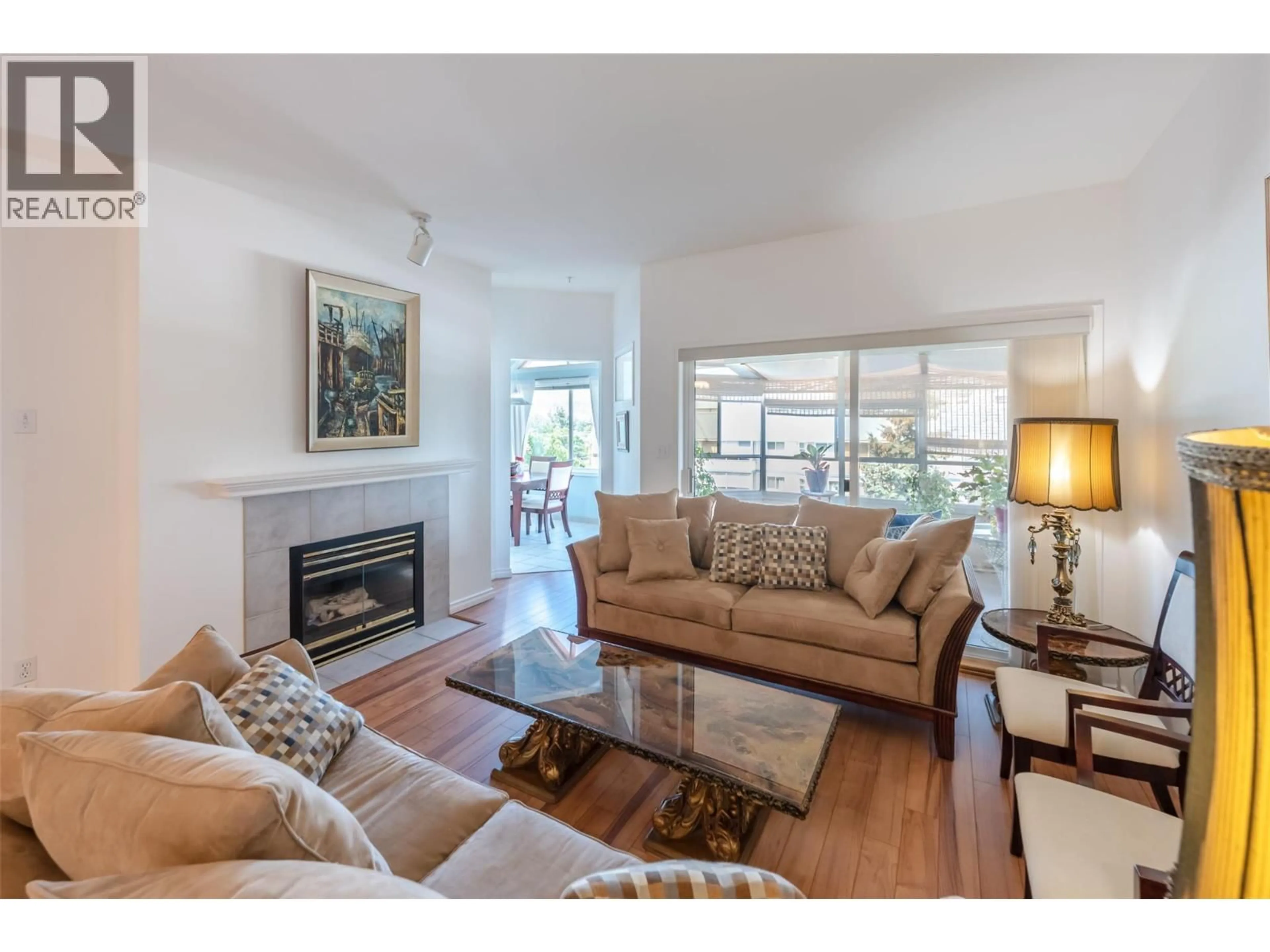 Living room with furniture, wood/laminate floor for 408 - 254 SCOTT AVENUE, Penticton British Columbia V2A2J5
