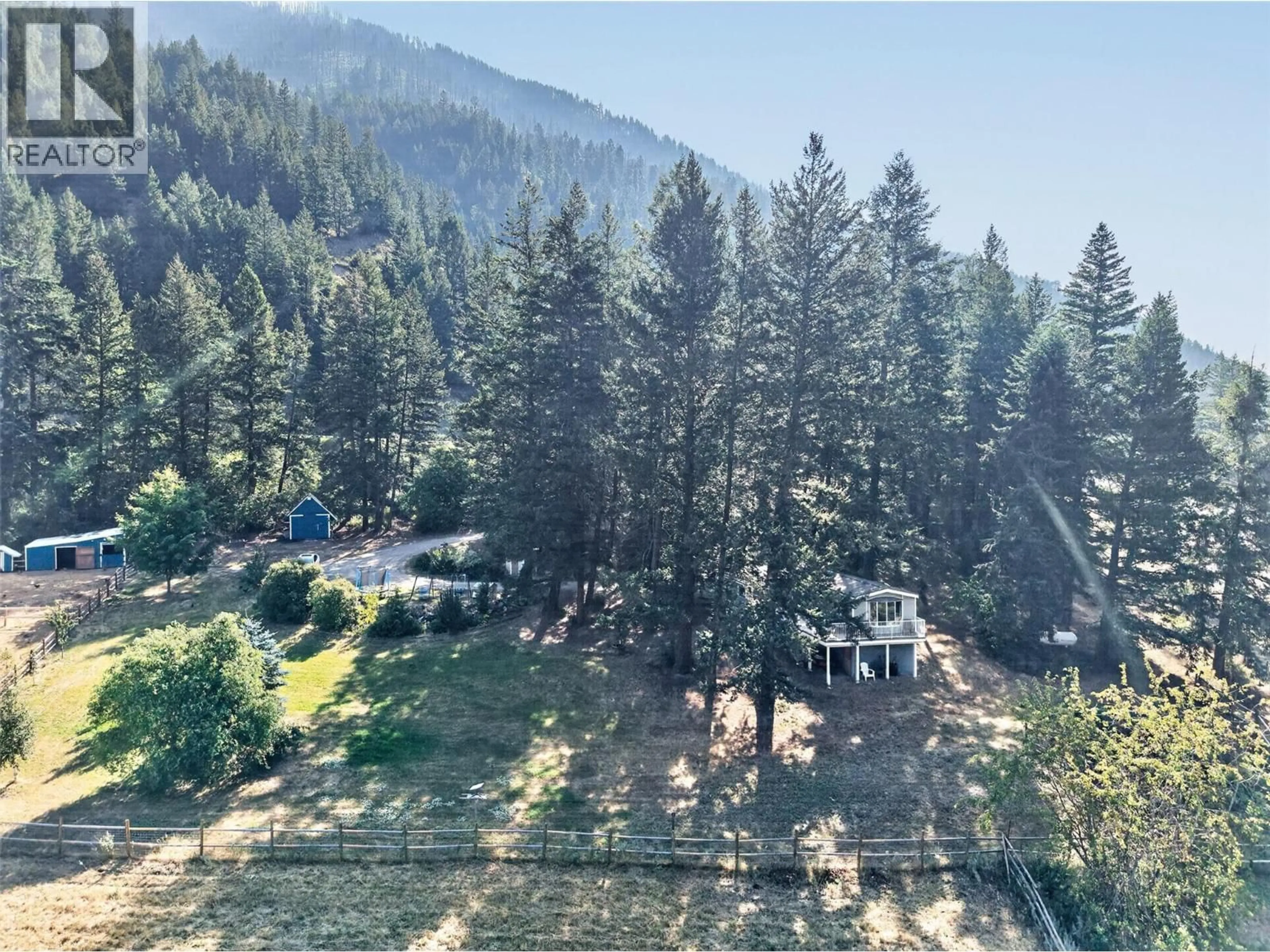 A pic from outside/outdoor area/front of a property/back of a property/a pic from drone, forest/trees view for 2464 CHASE-FALKLAND ROAD, Falkland British Columbia V0E1W1