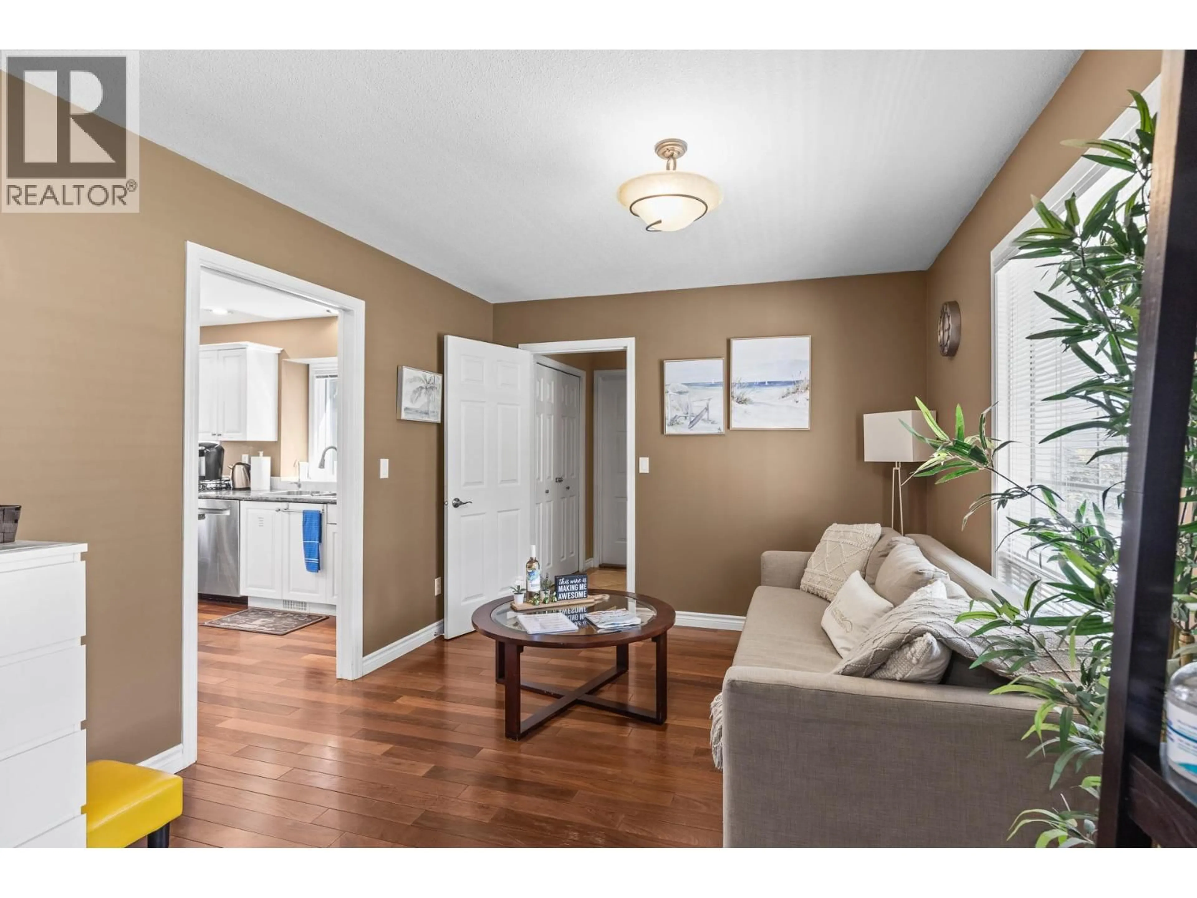 Living room with furniture, wood/laminate floor for 11523 PRETTY ROAD, Lake Country British Columbia V4V1G6
