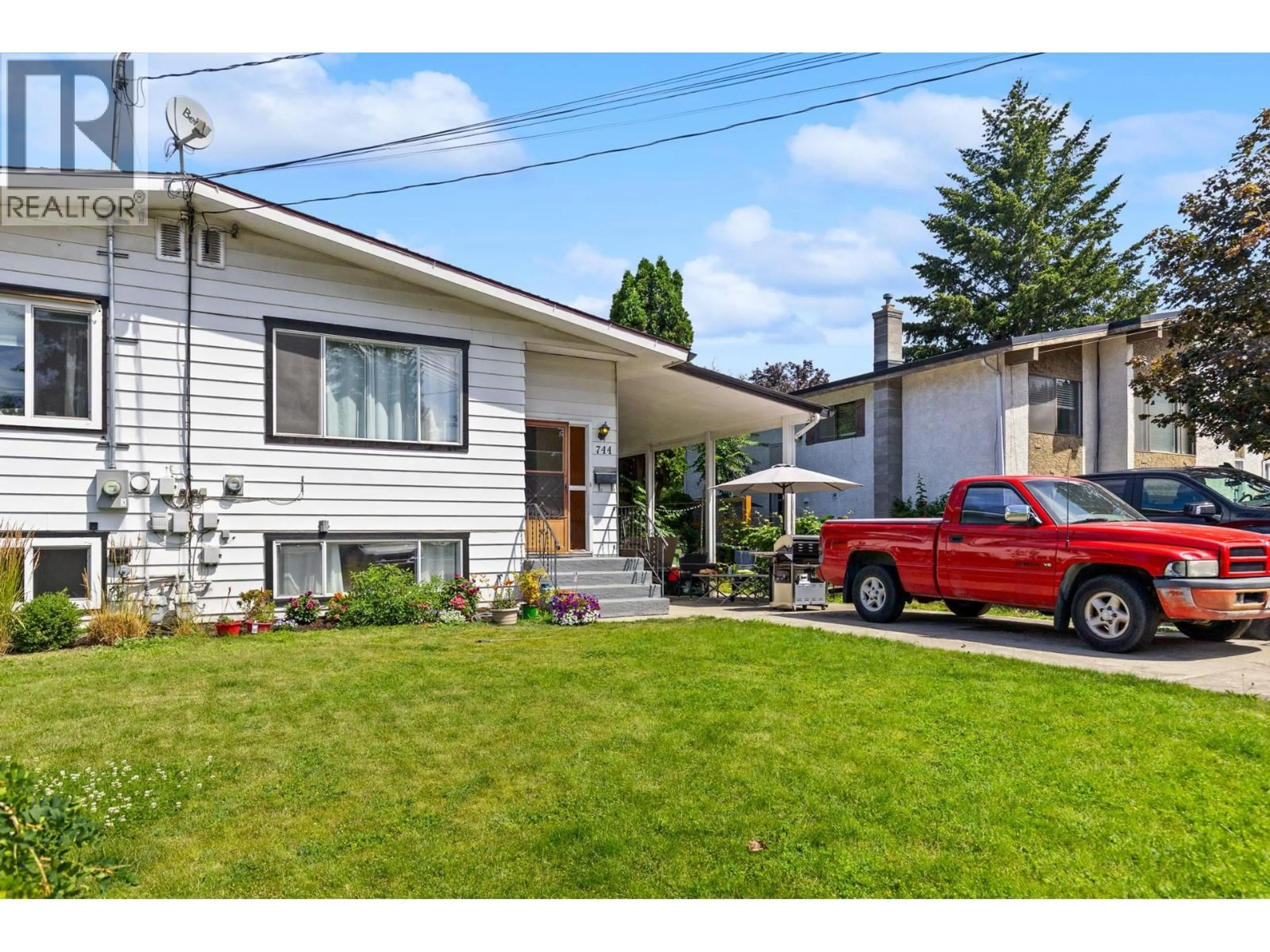 Home with vinyl exterior material, street for 744 MCCLURE ROAD, Kelowna British Columbia V1W1M3