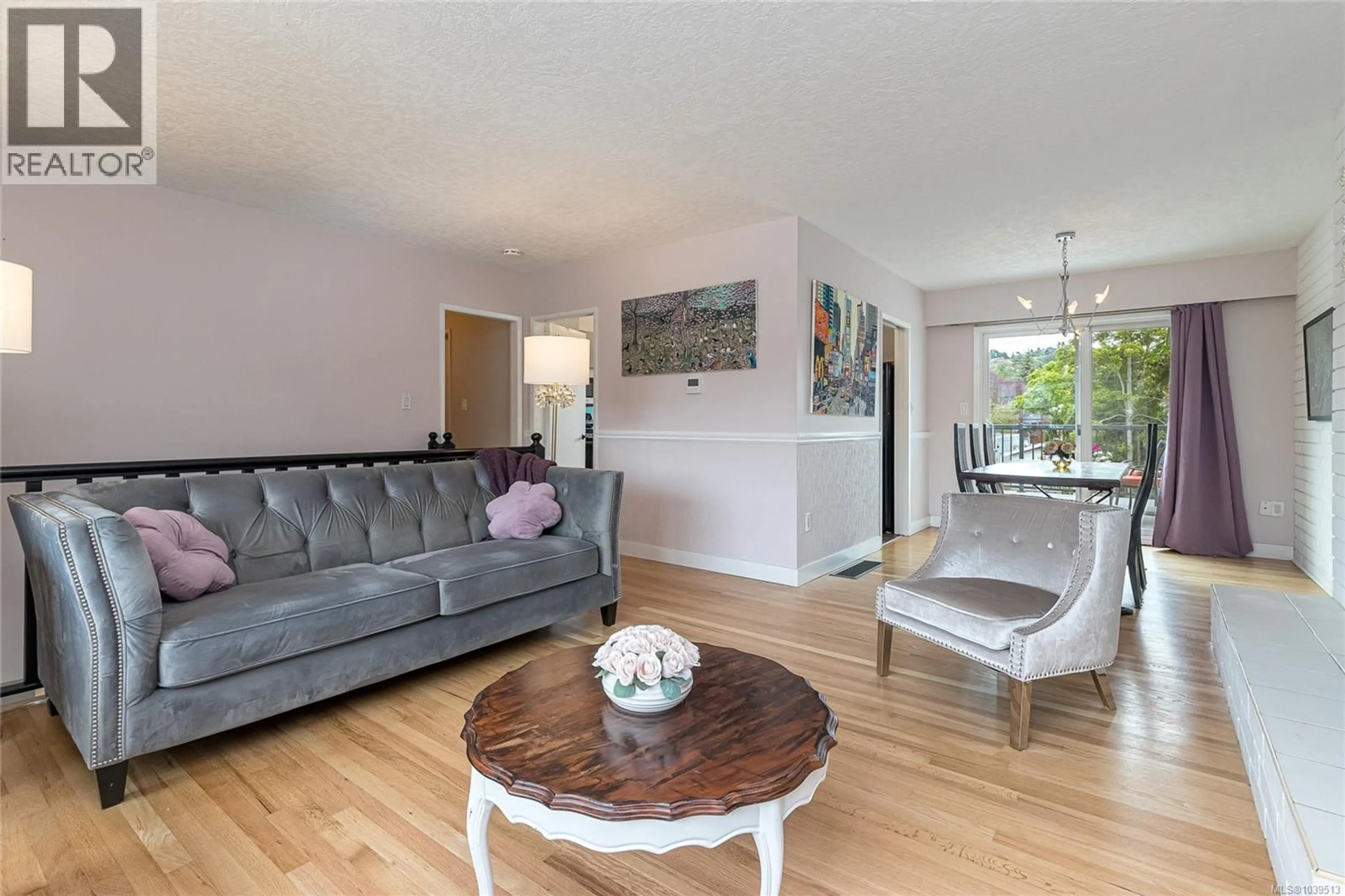 Living room with furniture, wood/laminate floor for 3881 OLIVIA PLACE, Saanich British Columbia V8P4T3