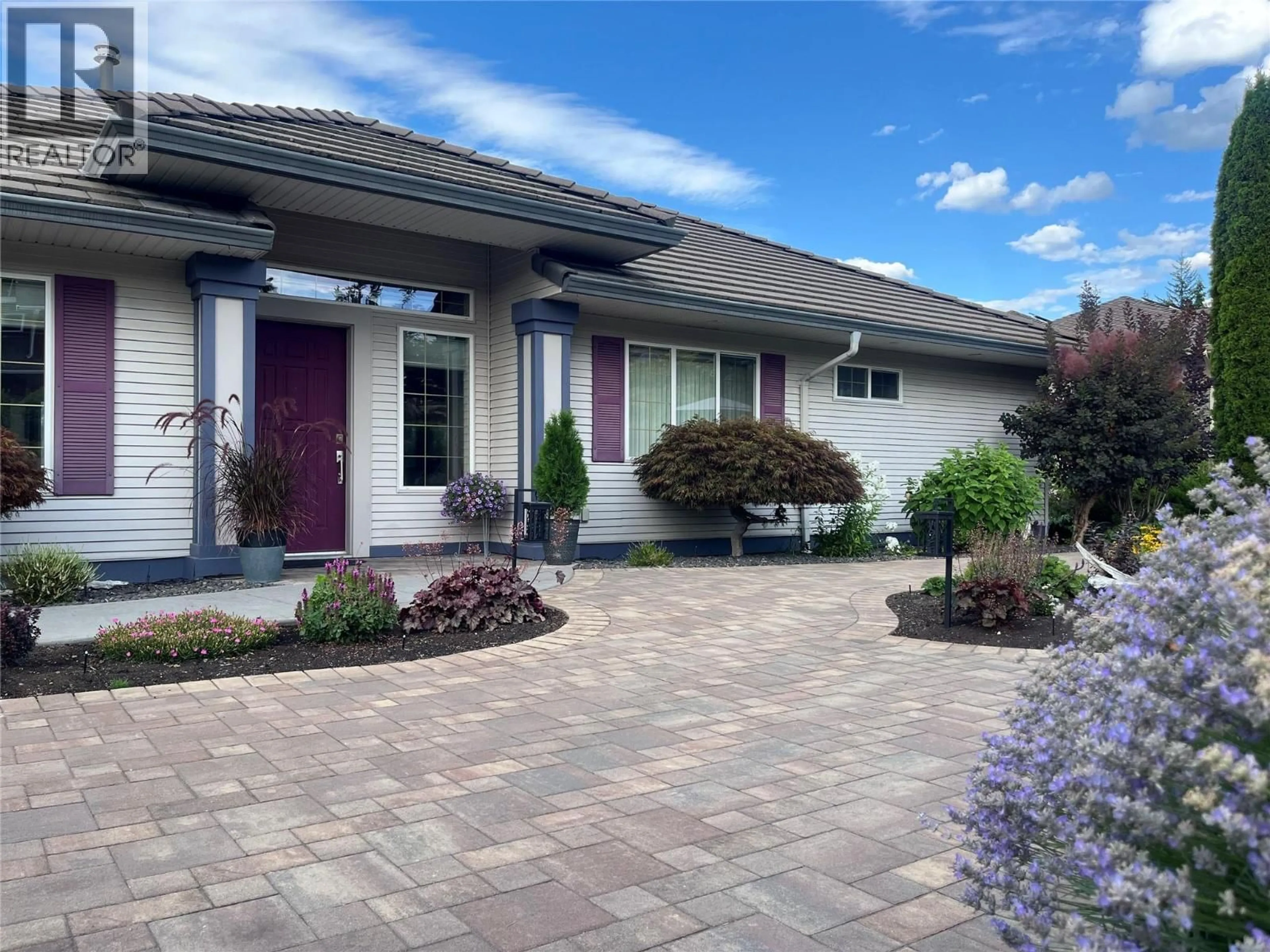 Home with vinyl exterior material, street for 2595 GOLF COURSE DRIVE, Blind Bay British Columbia V0E1H2