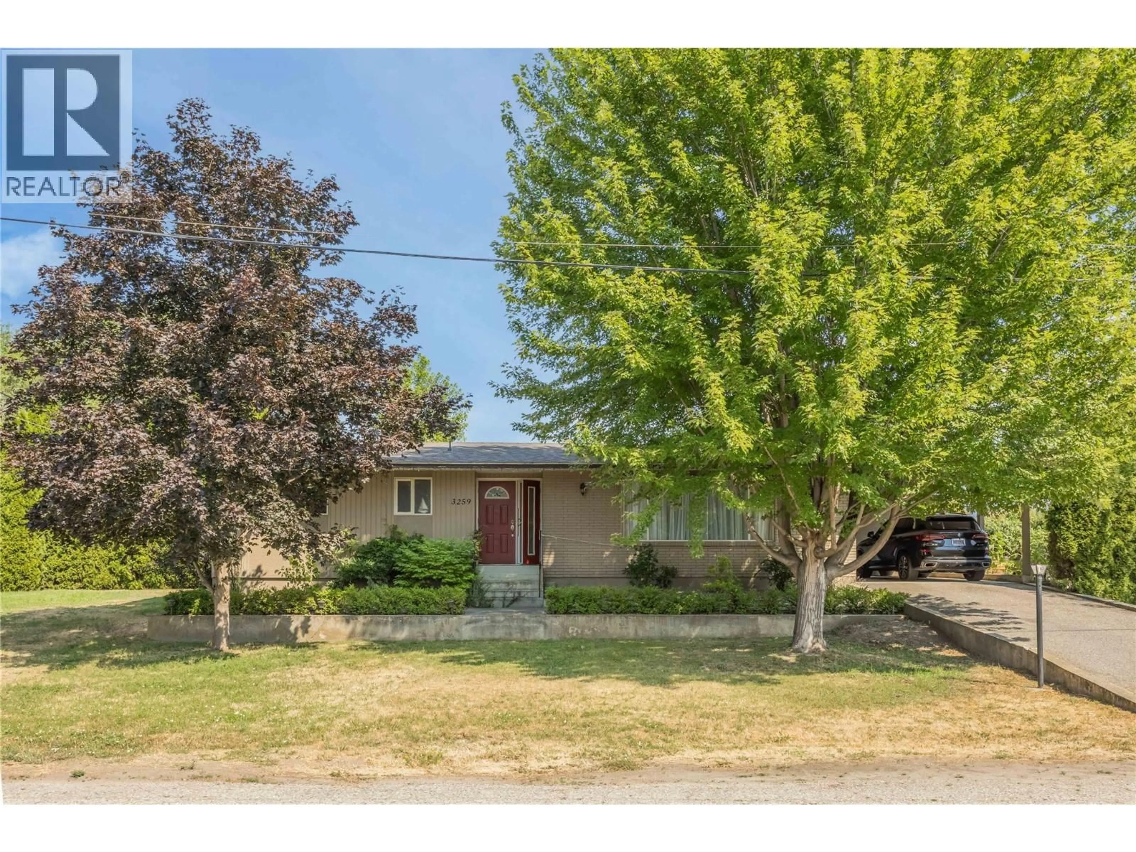 A pic from outside/outdoor area/front of a property/back of a property/a pic from drone, street for 3259 ST AMAND ROAD, Kelowna British Columbia V1W3P2