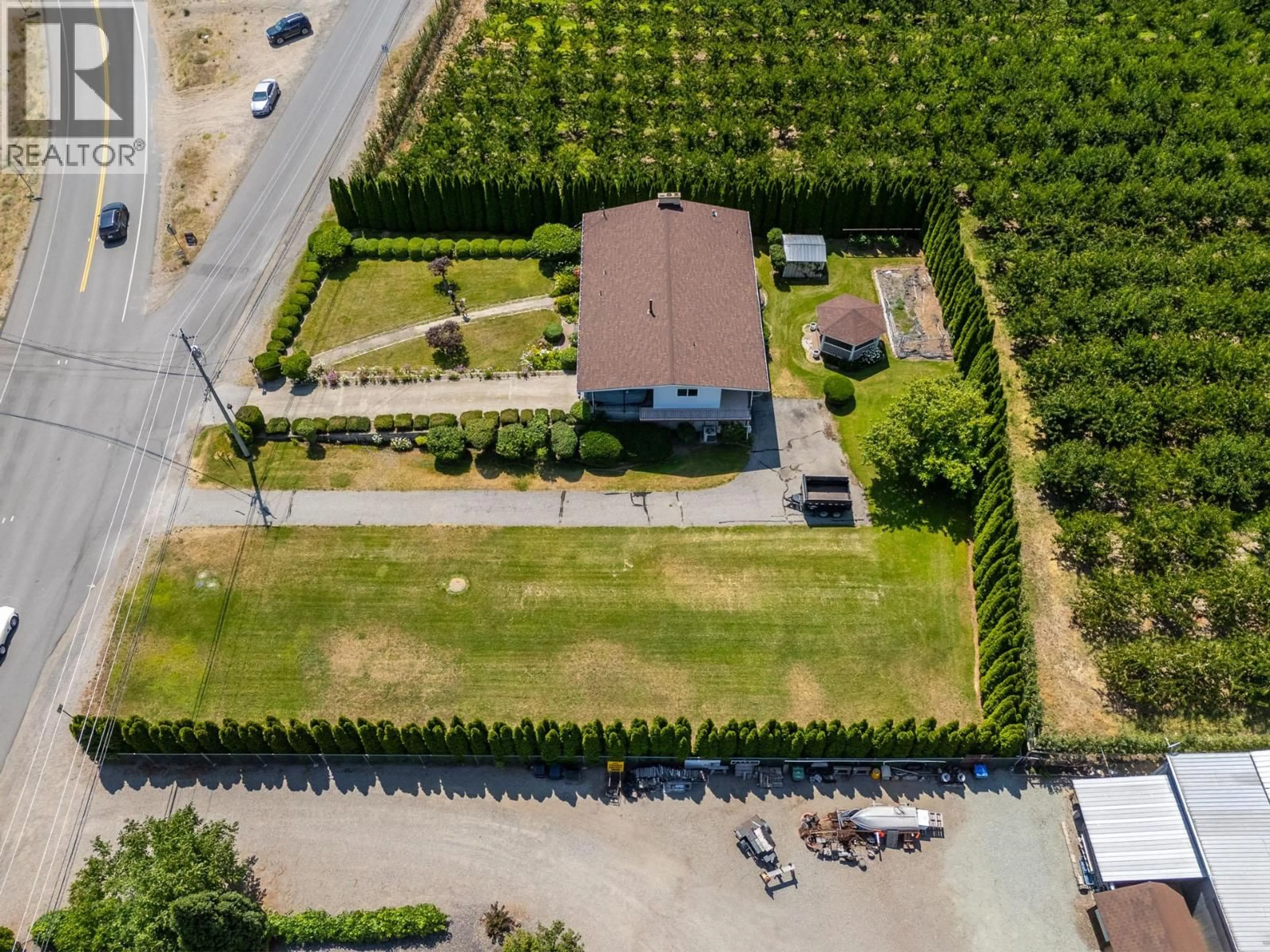 A pic from outside/outdoor area/front of a property/back of a property/a pic from drone, street for 6012 107TH STREET, Osoyoos British Columbia V0H1V4
