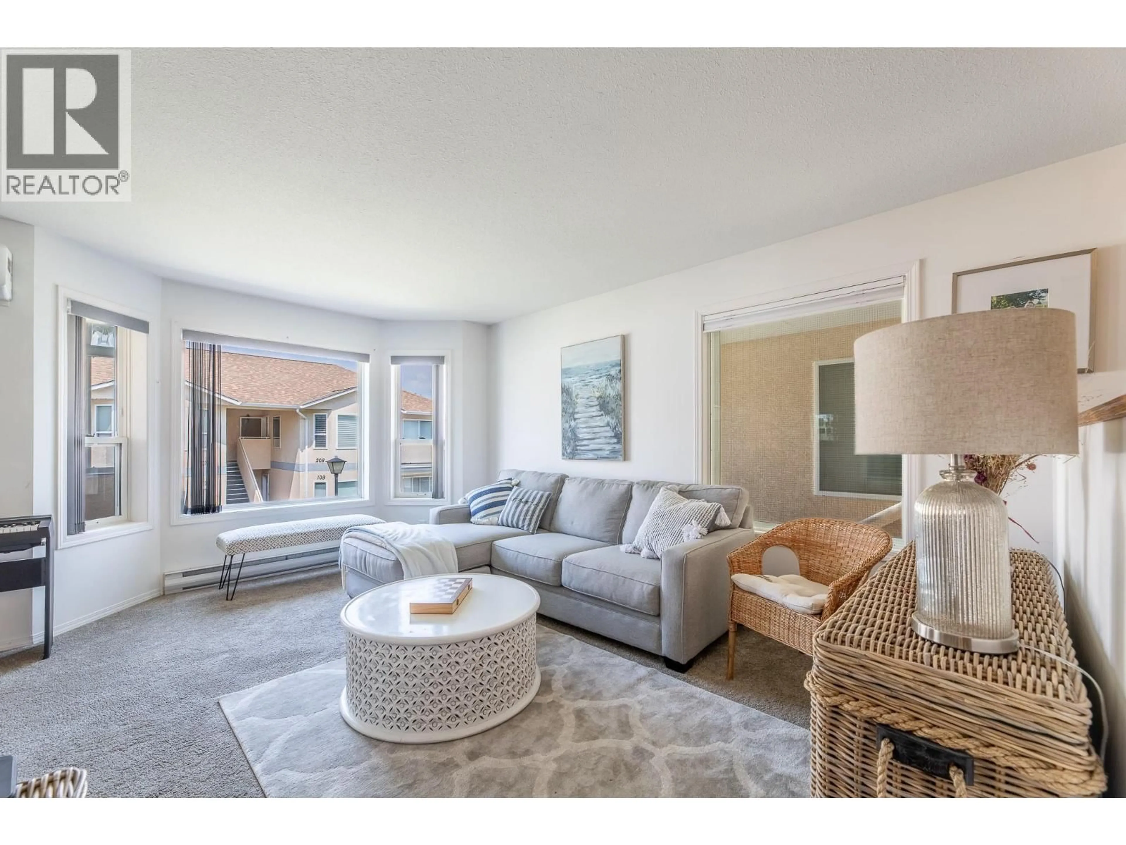 Living room with furniture, unknown for 203 - 13014 ARMSTRONG AVENUE, Summerland British Columbia V0H1Z5