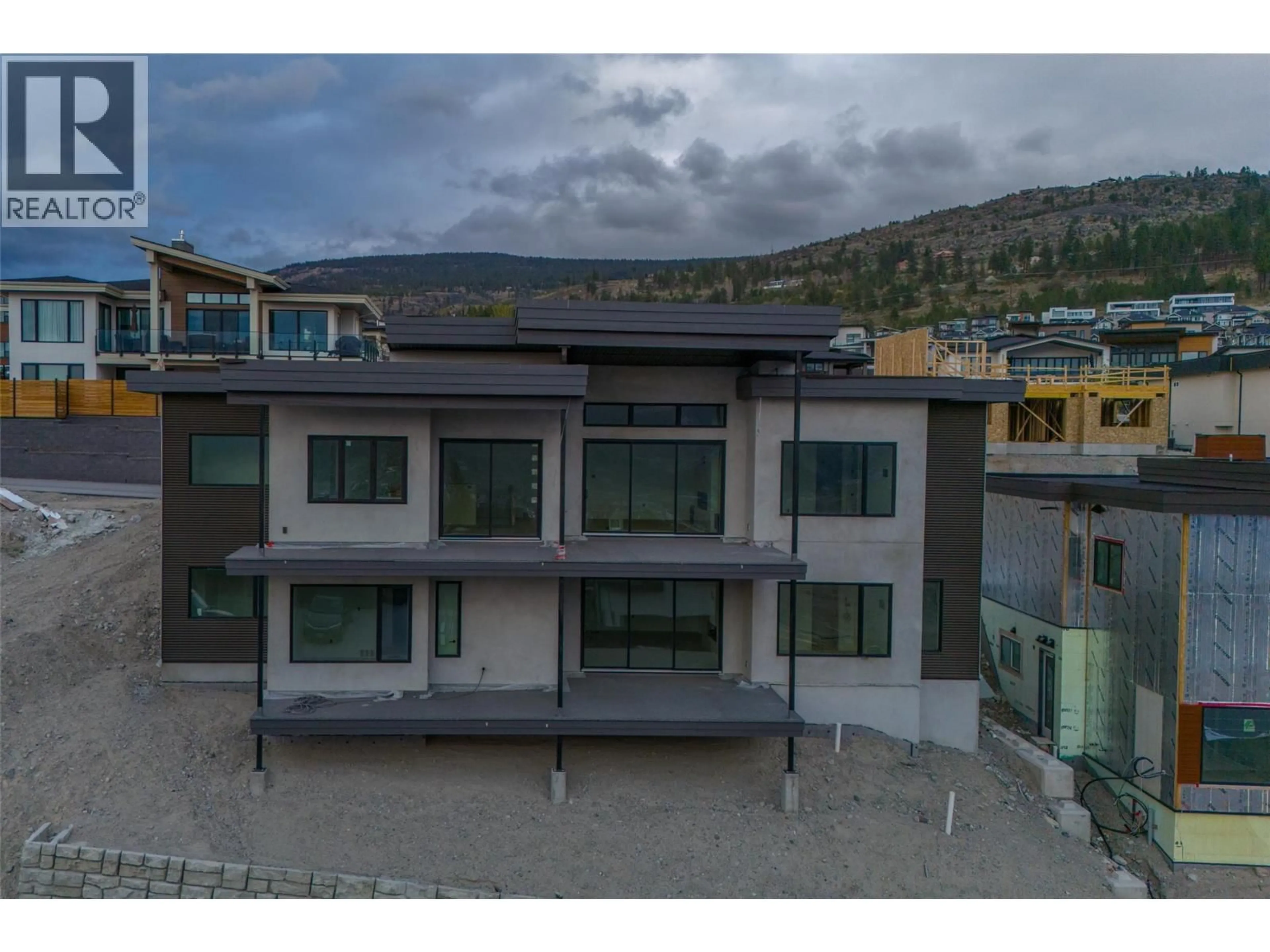 A pic from outside/outdoor area/front of a property/back of a property/a pic from drone, mountain view for 1092 ANTLER DRIVE, Penticton British Columbia V2A0J8