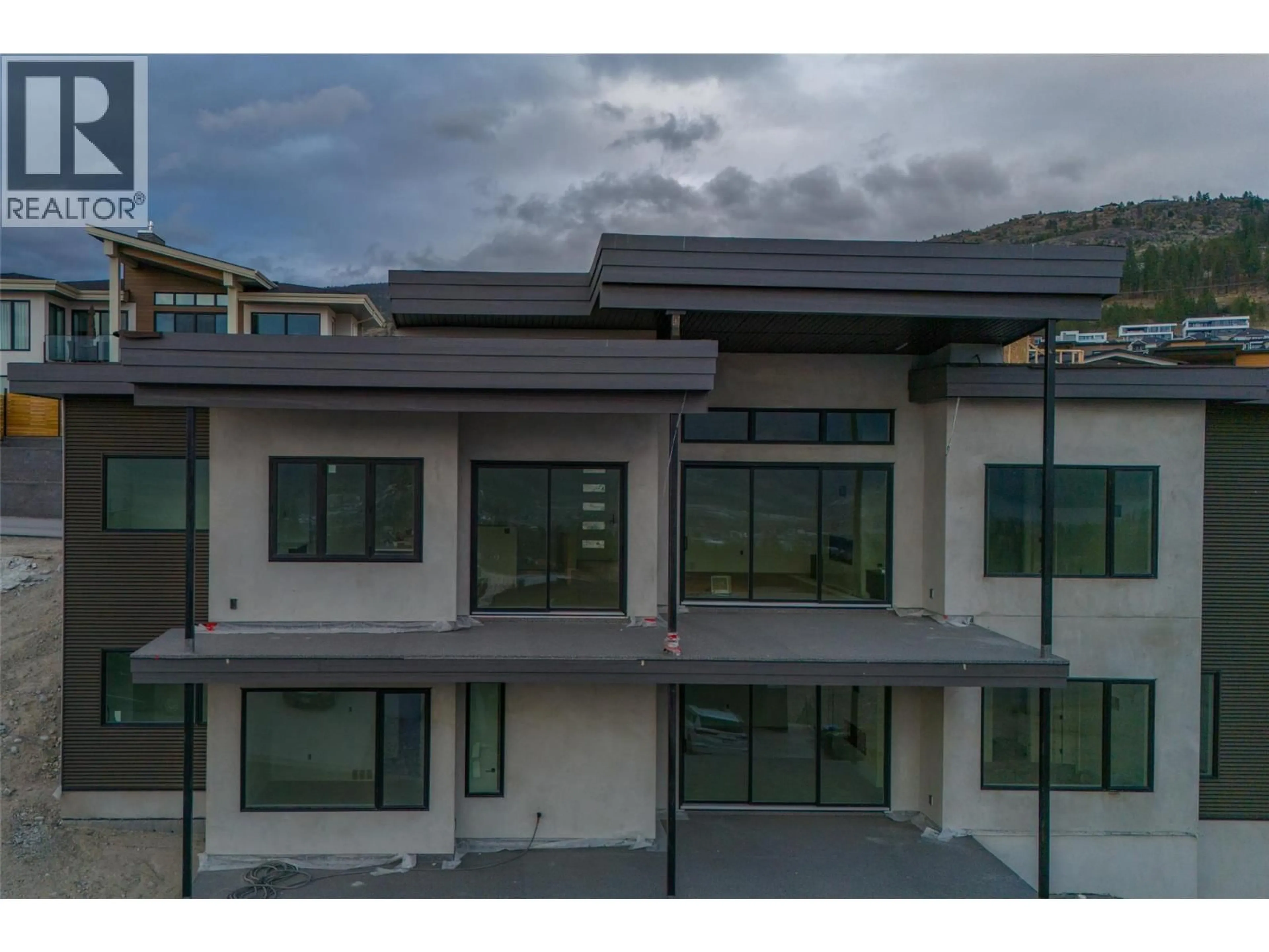 A pic from outside/outdoor area/front of a property/back of a property/a pic from drone, mountain view for 1092 ANTLER DRIVE, Penticton British Columbia V2A0J8
