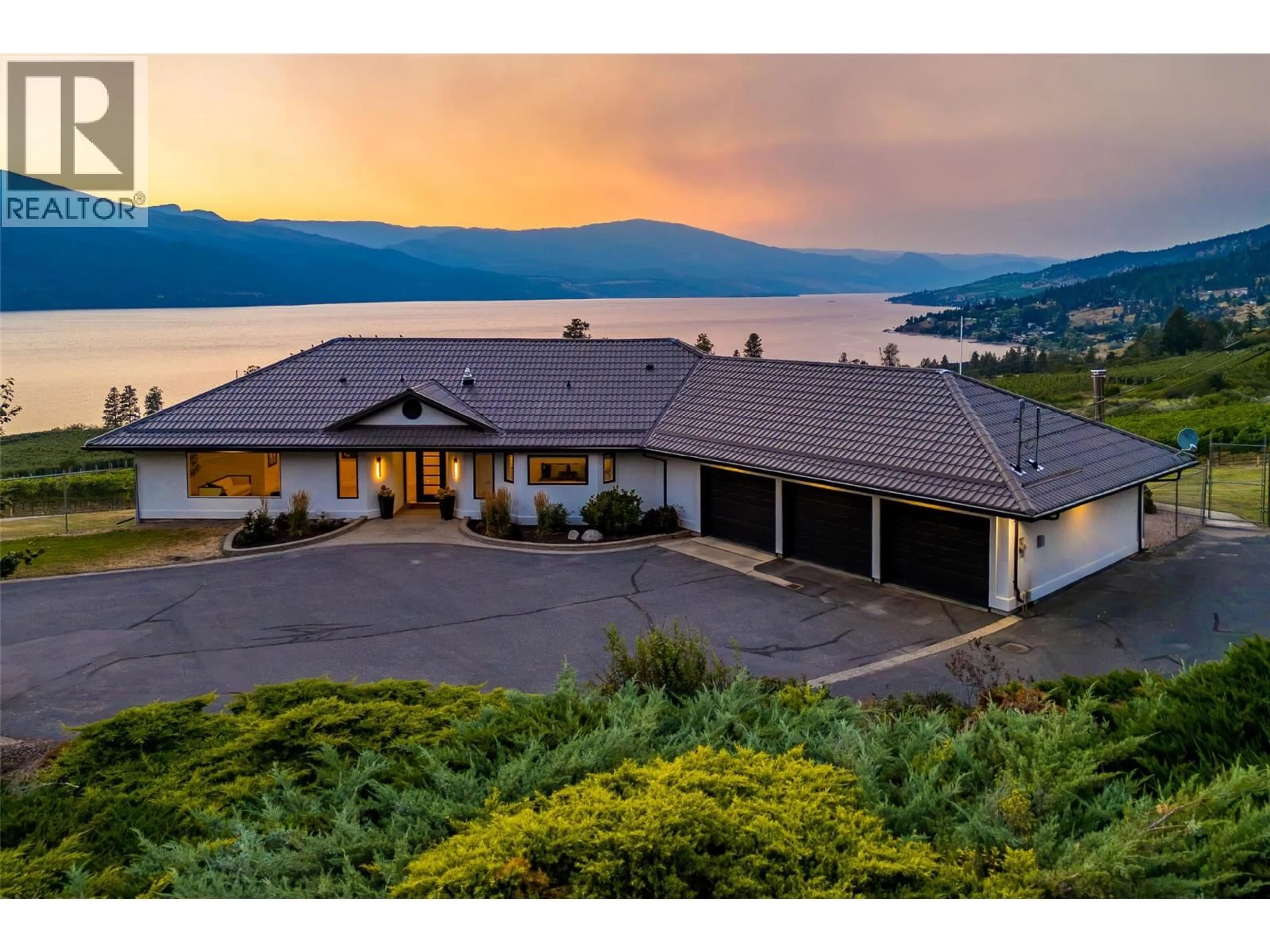 A pic from outside/outdoor area/front of a property/back of a property/a pic from drone, water/lake/river/ocean view for 1090 CAMP ROAD, Lake Country British Columbia V4V2H4