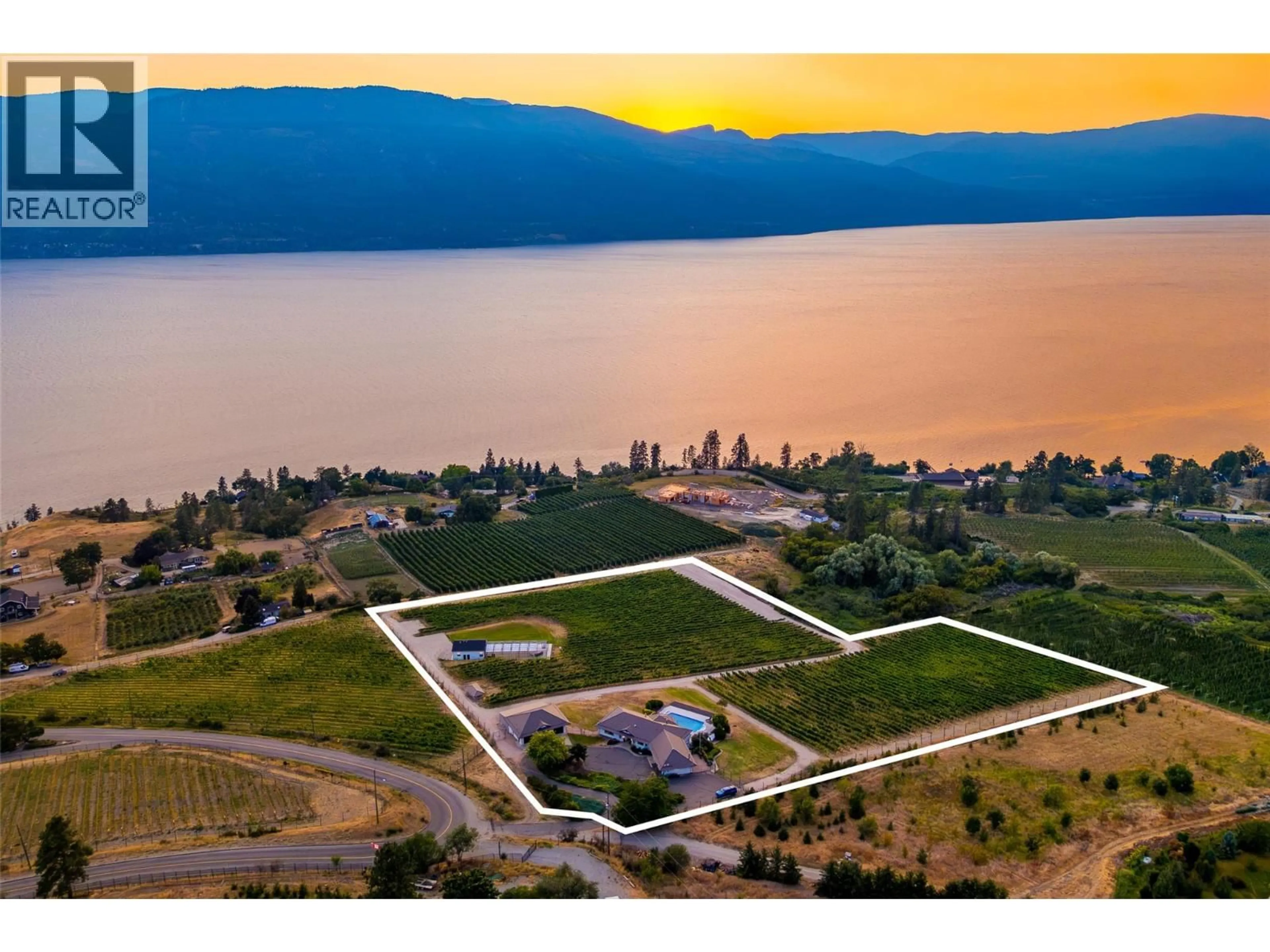 A pic from outside/outdoor area/front of a property/back of a property/a pic from drone, water/lake/river/ocean view for 1090 CAMP ROAD, Lake Country British Columbia V4V2H4