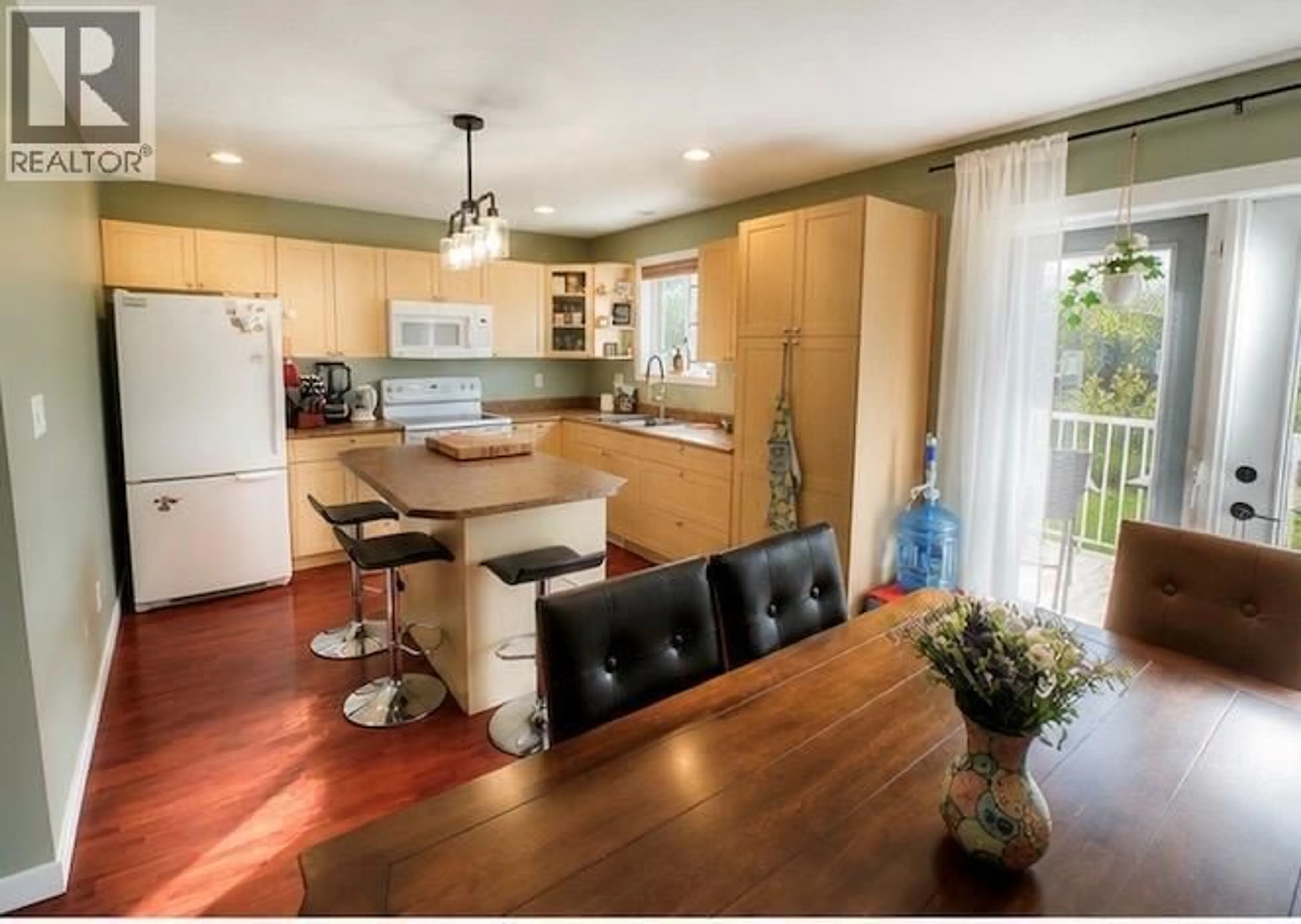 Open concept kitchen, wood/laminate floor for 5213 40 ST NE STREET, Chetwynd British Columbia V0C1J0