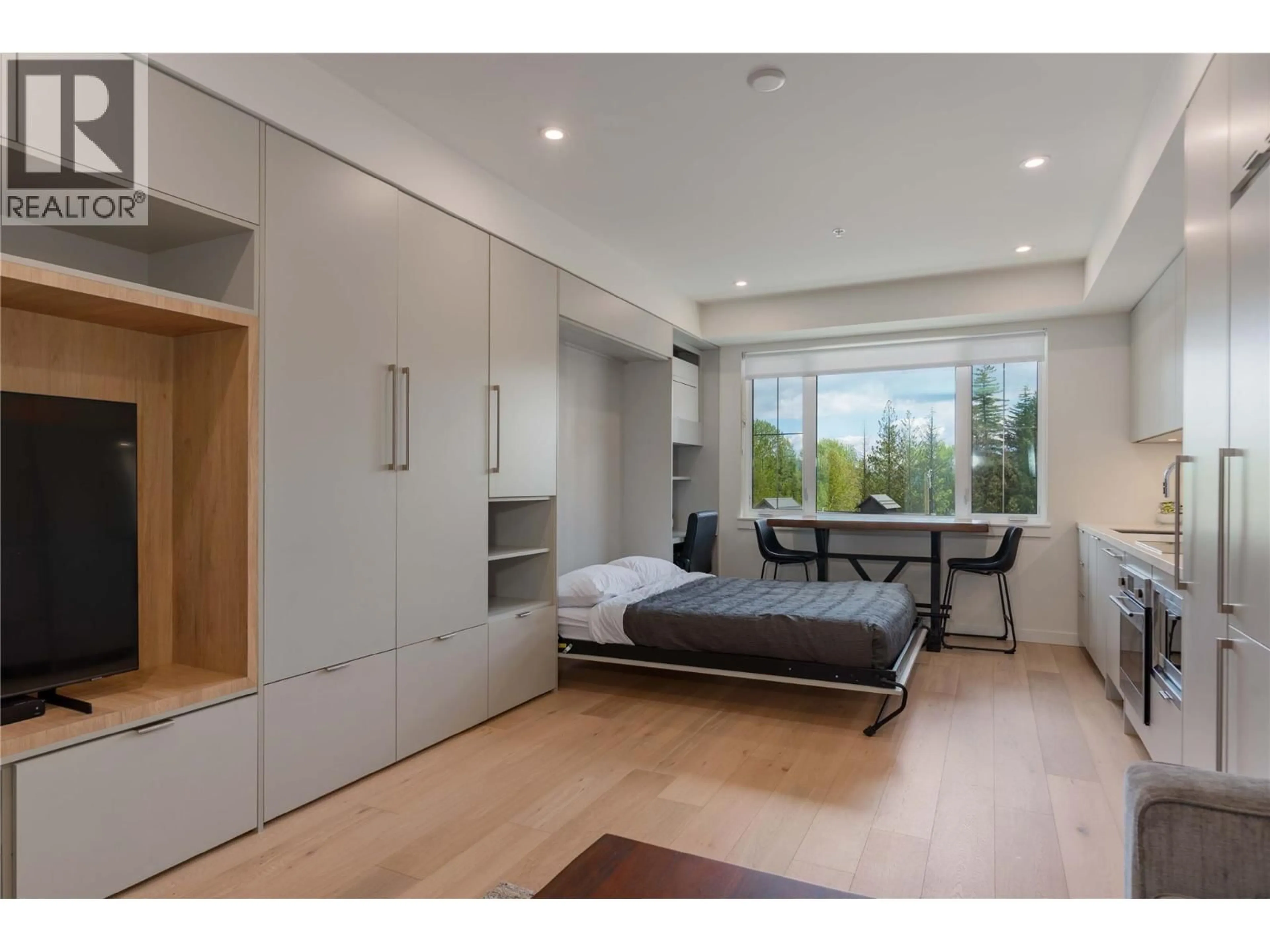 Bedroom with bed, wood/laminate floor for 115 - 4280 RED MOUNTAIN ROAD, Rossland British Columbia V0G1Y0