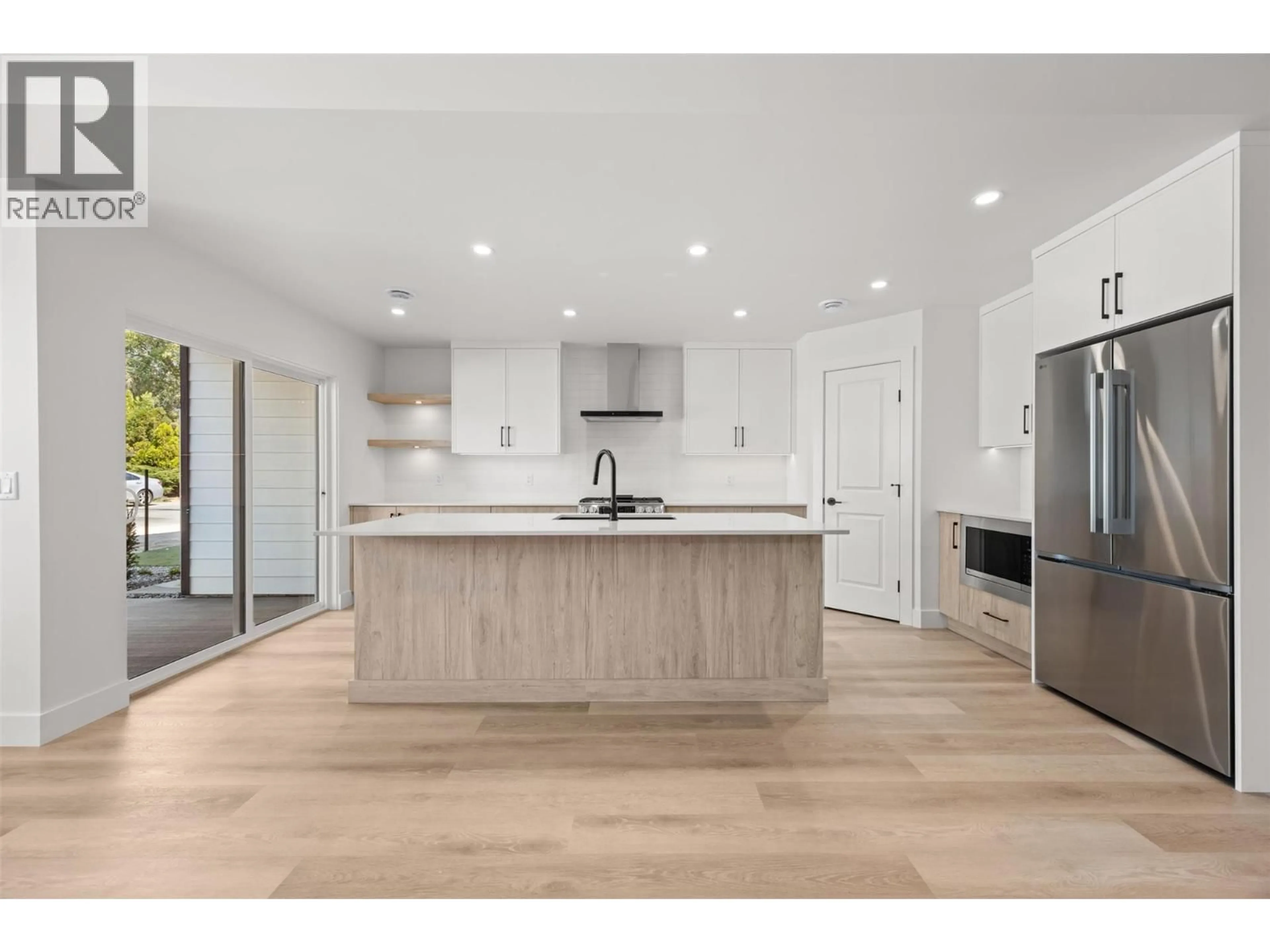 Open concept kitchen, wood/laminate floor for 1 - 773 KINNEAR AVENUE, Kelowna British Columbia V1Y5B2