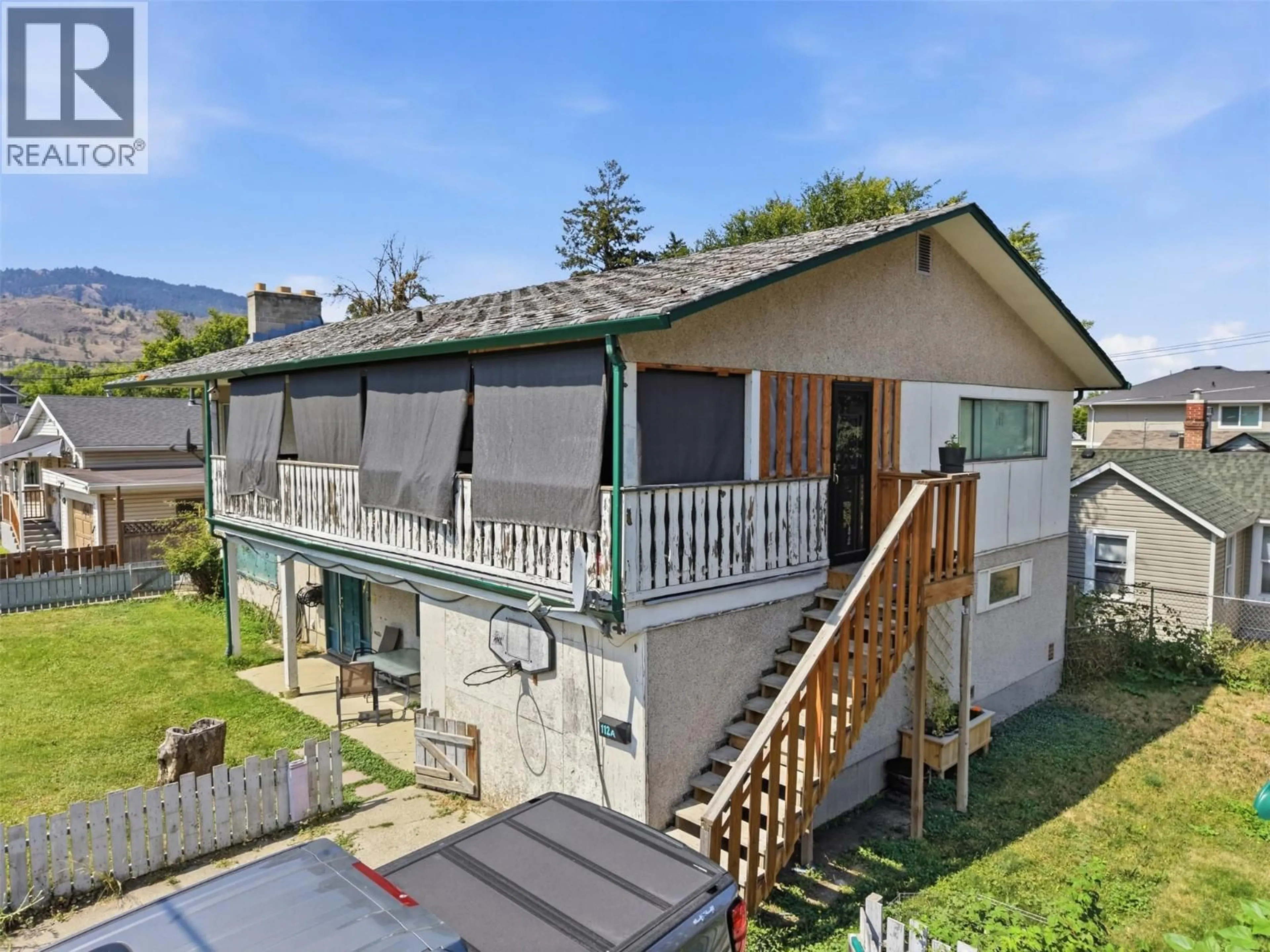 A pic from outside/outdoor area/front of a property/back of a property/a pic from drone, mountain view for 112 WILLIAMS STREET, Kamloops British Columbia V2B3Z6