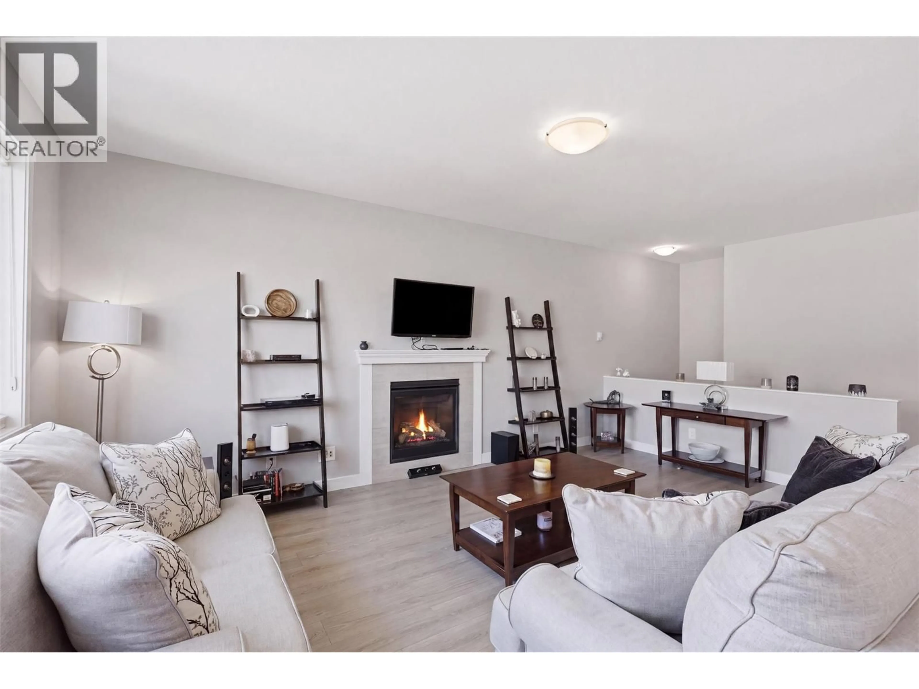 Living room with furniture, wood/laminate floor for 2352 BOSSERT AVENUE, Kamloops British Columbia V2B4V6