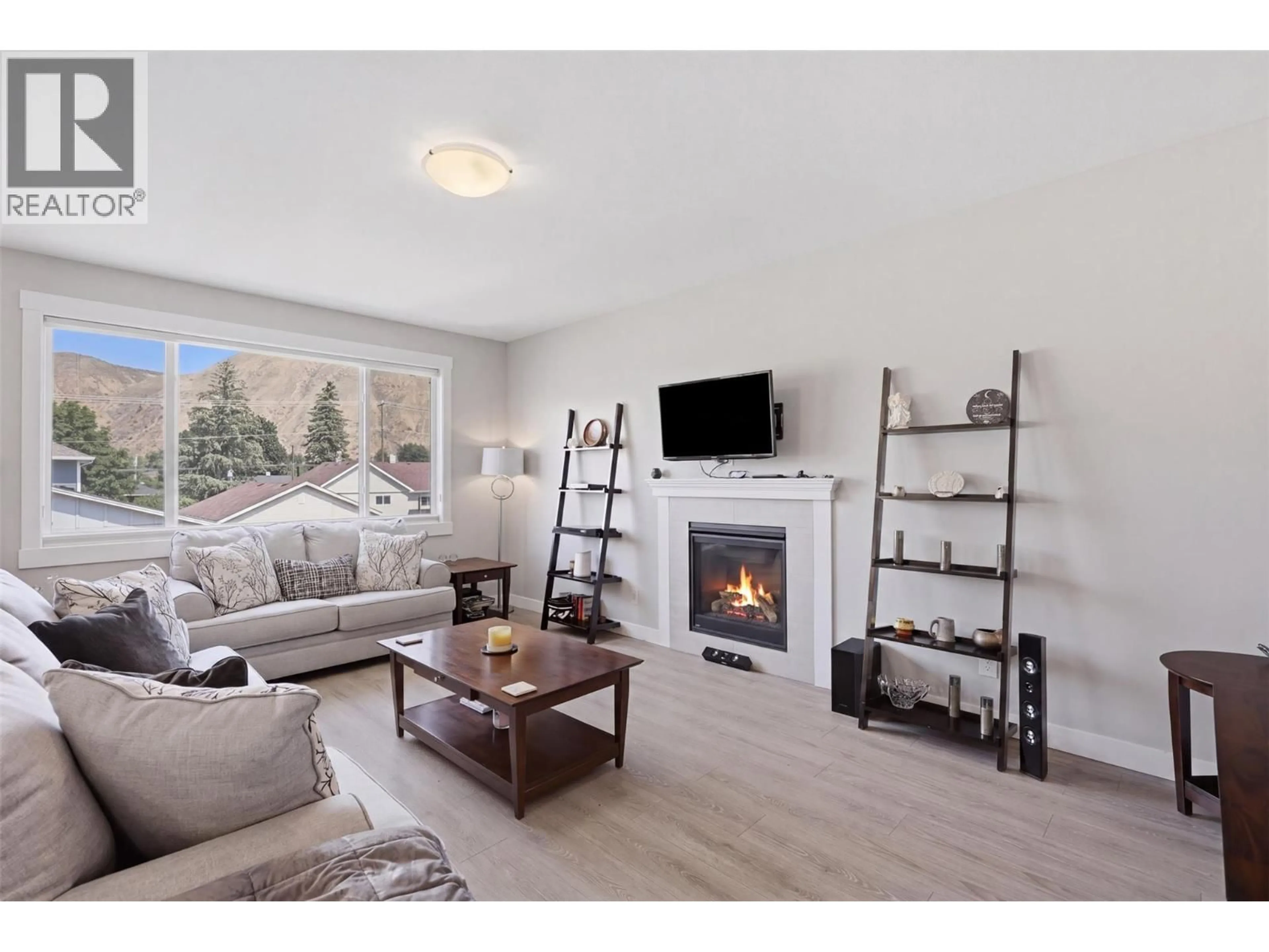 Living room with furniture, wood/laminate floor for 2352 BOSSERT AVENUE, Kamloops British Columbia V2B4V6