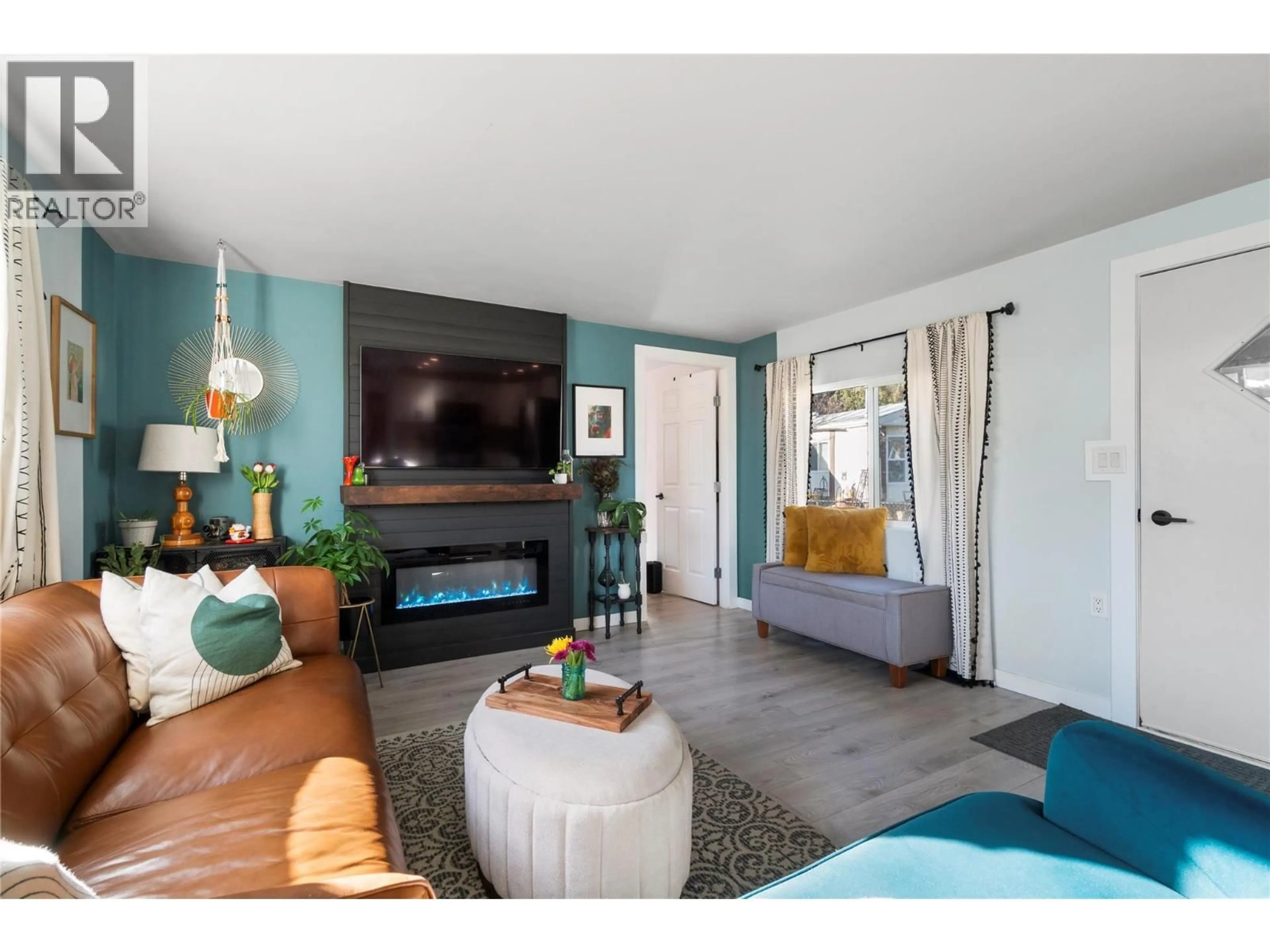 Living room with furniture, wood/laminate floor for 5131 69 AVENUE NORTHEAST, Canoe British Columbia V0E1K0