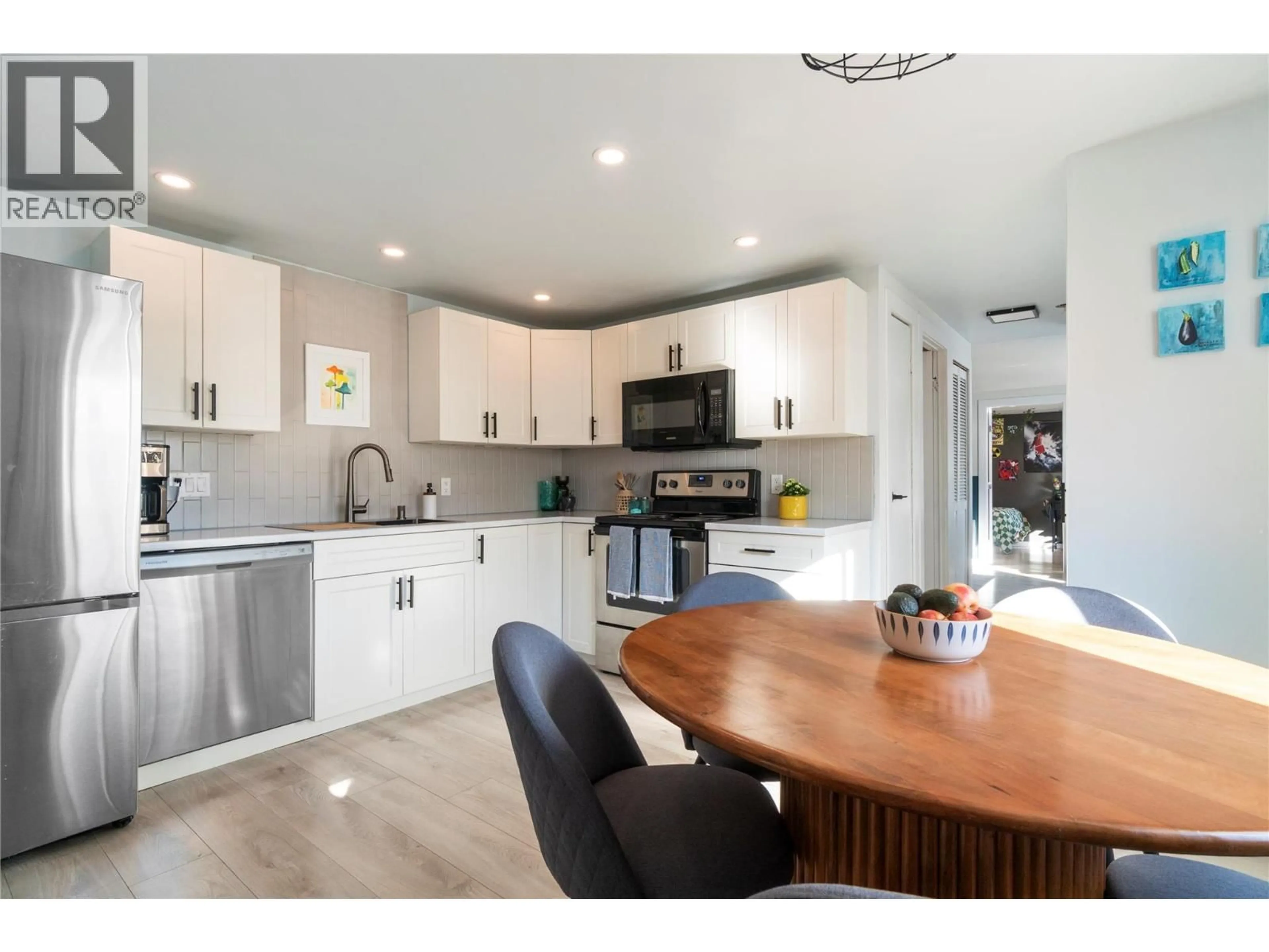 Open concept kitchen, wood/laminate floor for 5131 69 AVENUE NORTHEAST, Canoe British Columbia V0E1K0