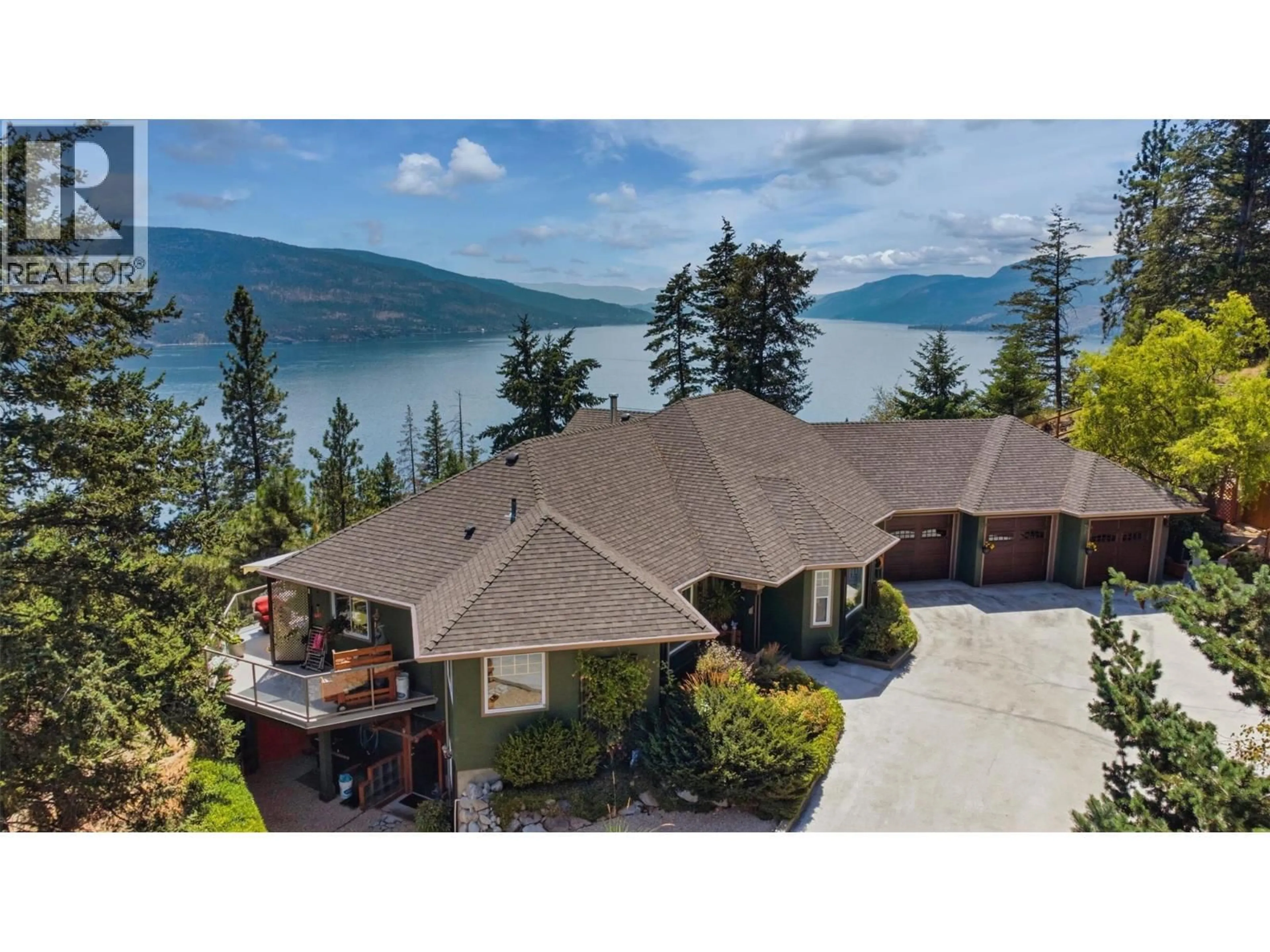 A pic from outside/outdoor area/front of a property/back of a property/a pic from drone, water/lake/river/ocean view for 594 MOUNTAIN DRIVE, Vernon British Columbia V1H2B7