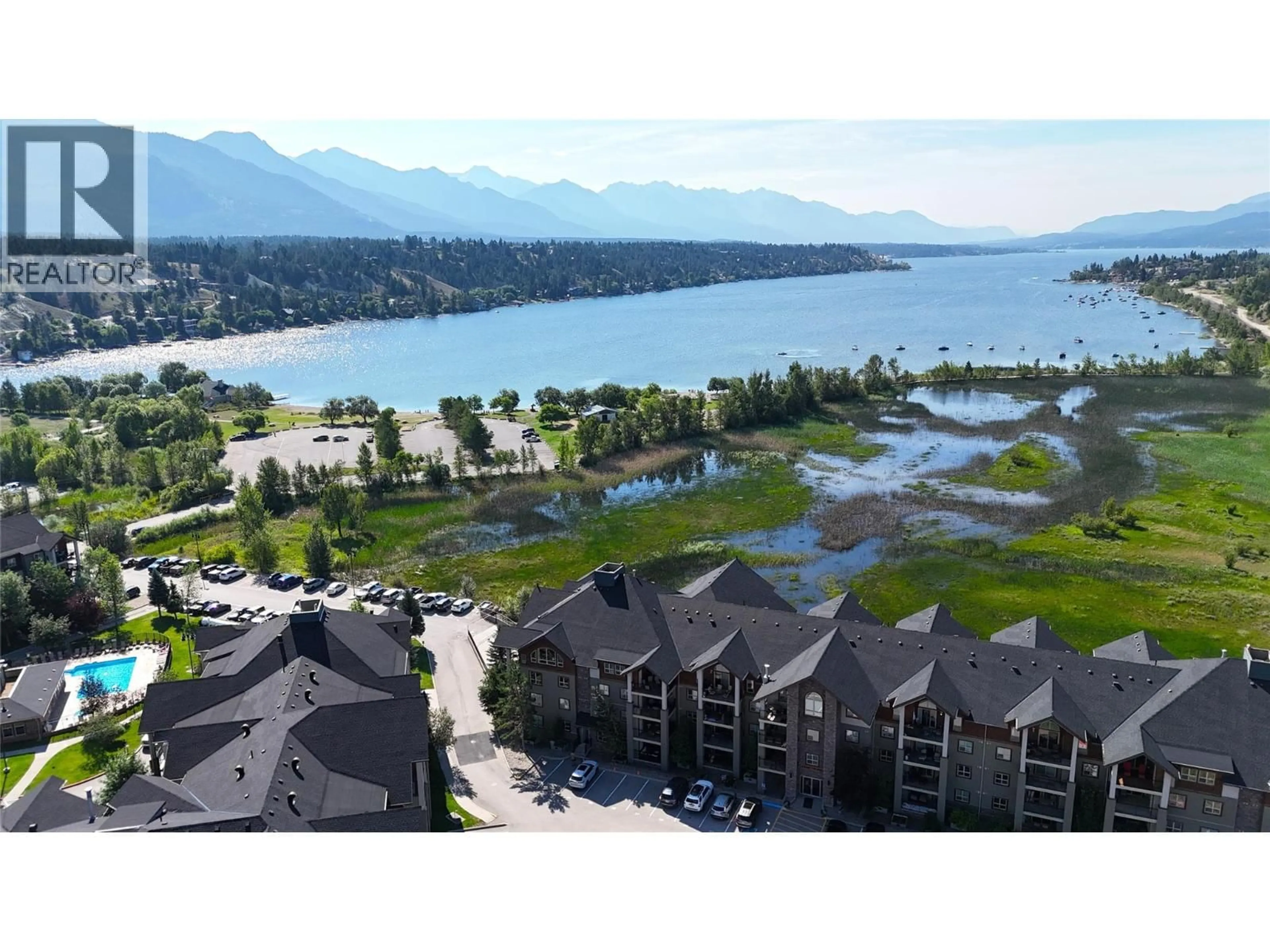 A pic from outside/outdoor area/front of a property/back of a property/a pic from drone, water/lake/river/ocean view for 1403 - 205 THIRD AVENUE, Invermere British Columbia V0A1K7